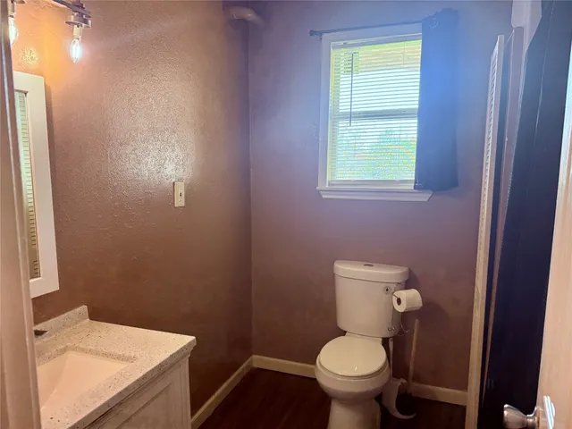 a bathroom with a toilet and a sink