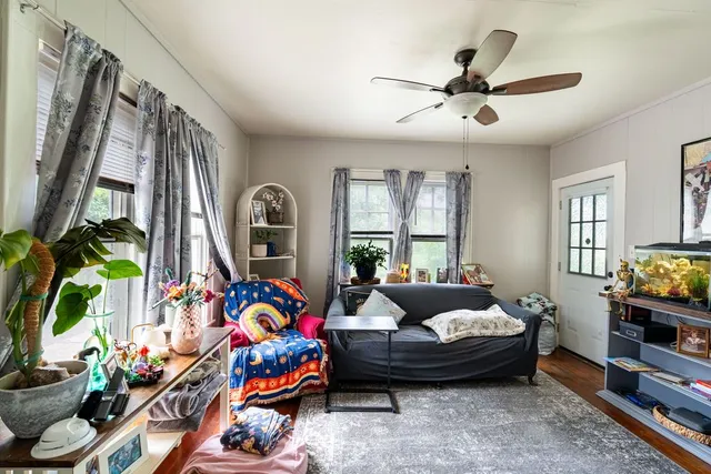 a living room with furniture fireplace and flat screen tv
