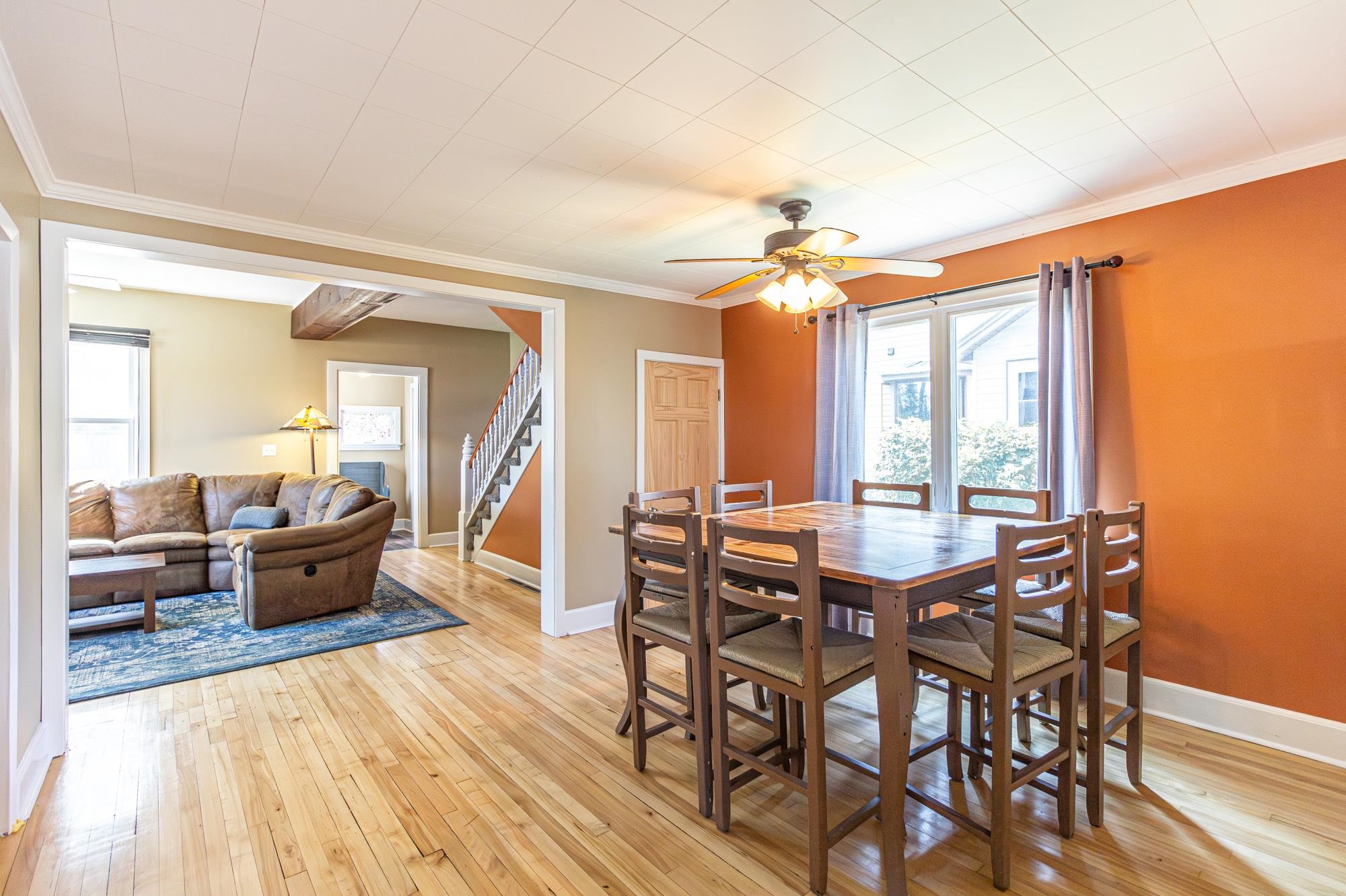 1151 East Camp Street Ely, MN 55731 - Photo 14 of 45 Dining room featuring light wood-type flooring, crown molding, and ceiling fan