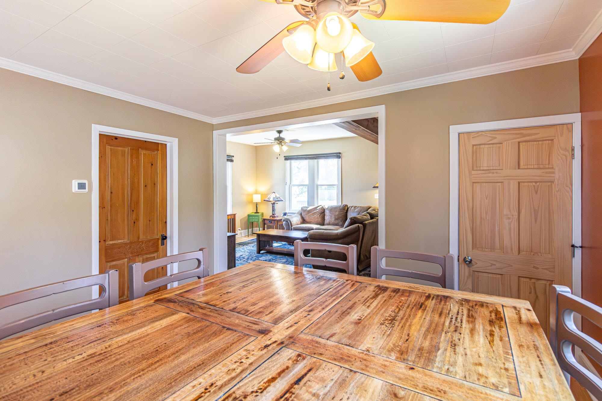 1151 East Camp Street Ely, MN 55731 - Photo 17 of 45 Dining area with ceiling fan and ornamental molding