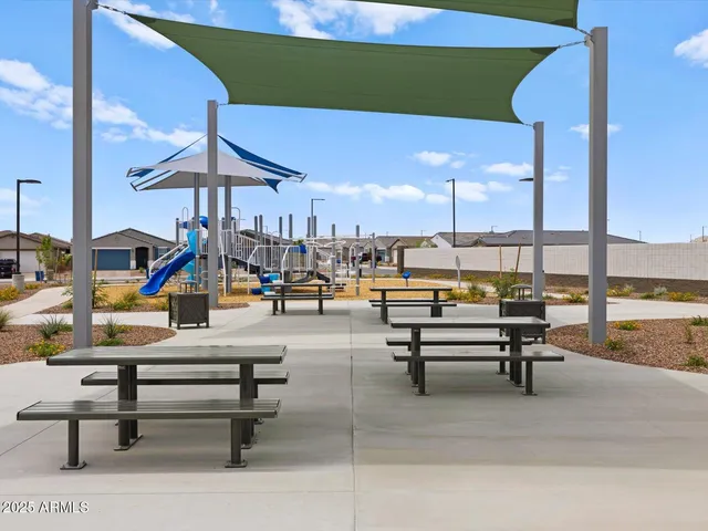 a view of a swimming pool with a lounge chairs