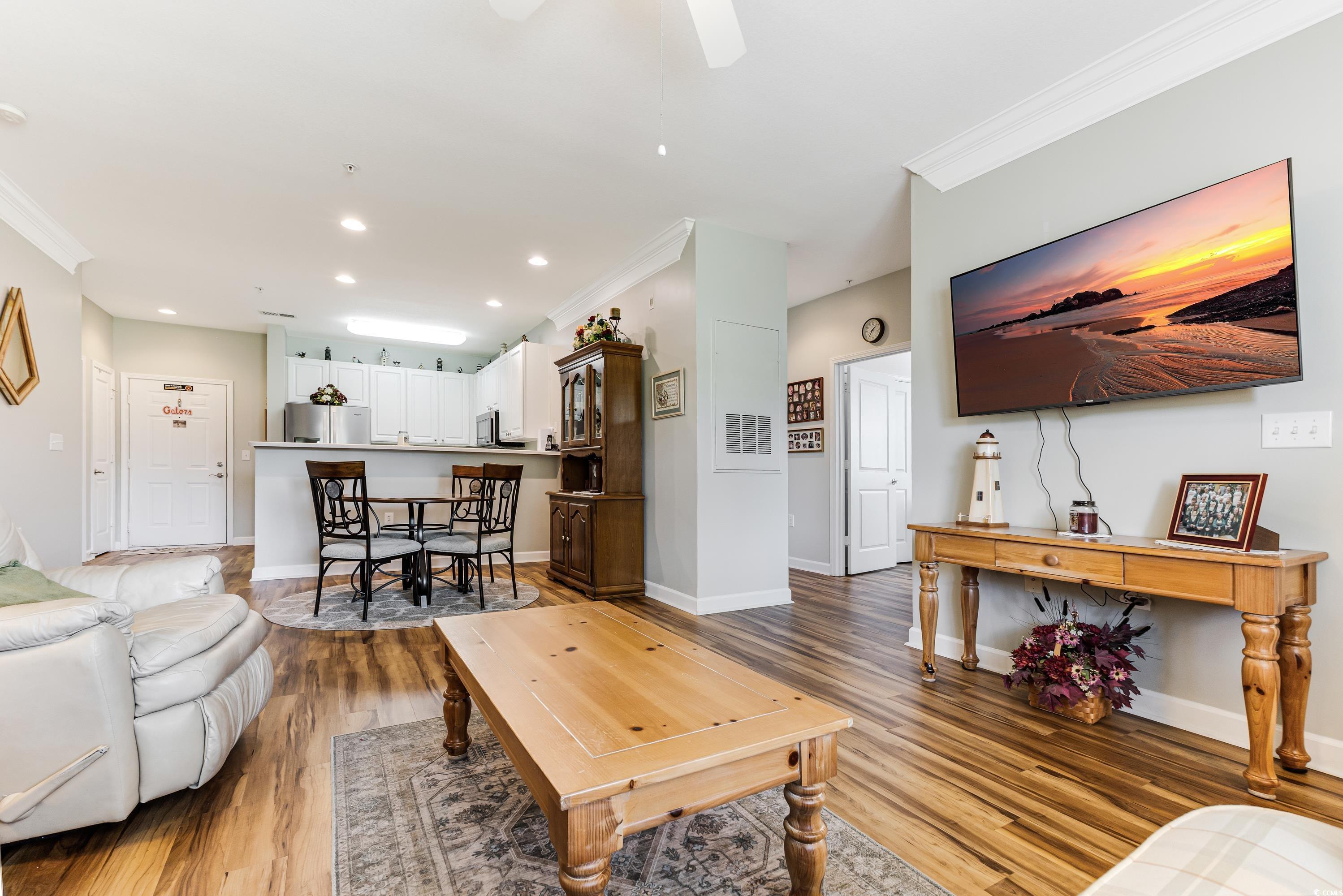 260 Woodlands Way, Unit 2 Calabash, NC 28467 - Photo 13 of 40 Living room with ornamental molding, wood finished floors, recessed lighting, baseboards, and a ceiling fan