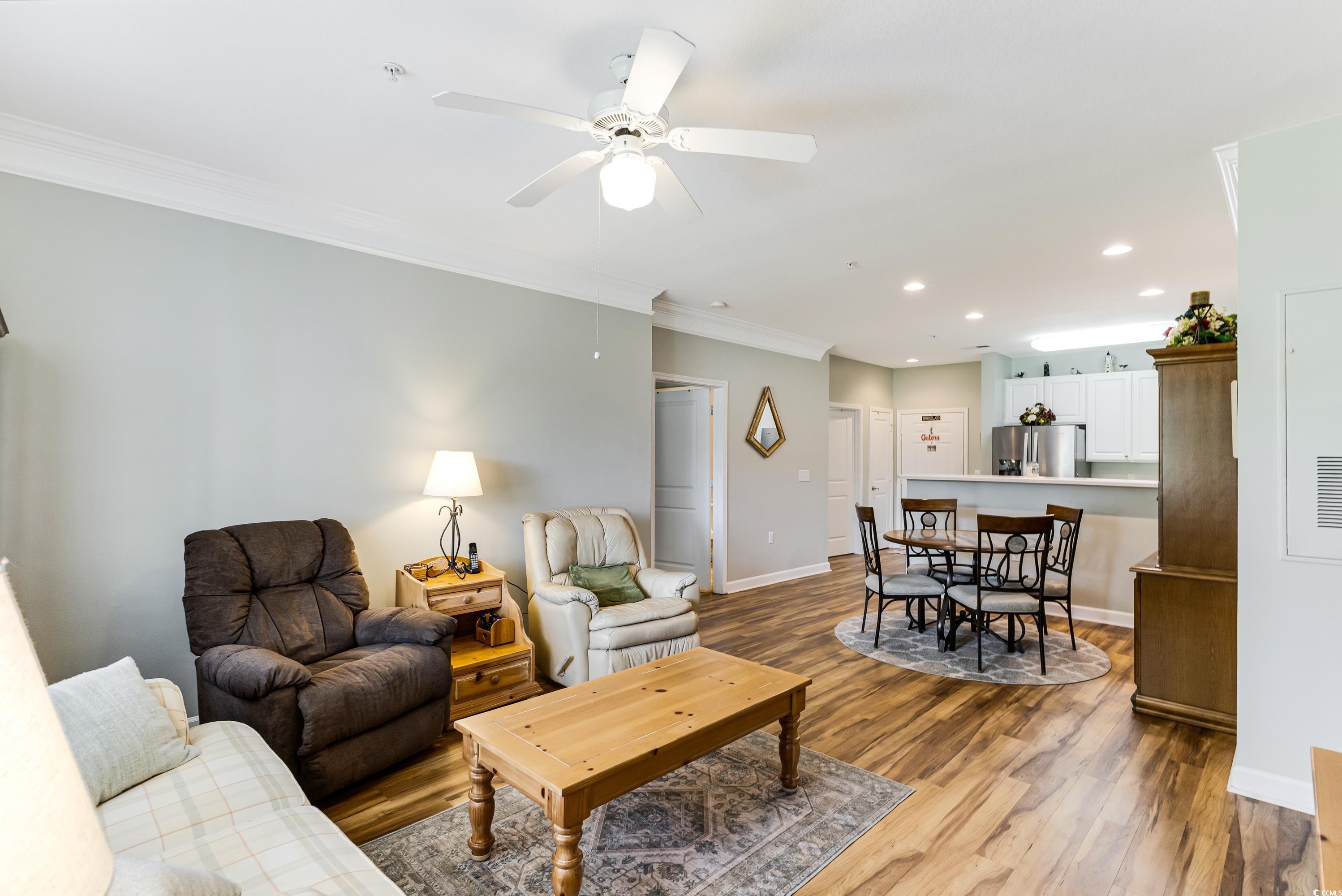 260 Woodlands Way, Unit 2 Calabash, NC 28467 - Photo 14 of 40 Living room featuring light wood-style floors, ornamental molding, recessed lighting, baseboards, and ceiling fan