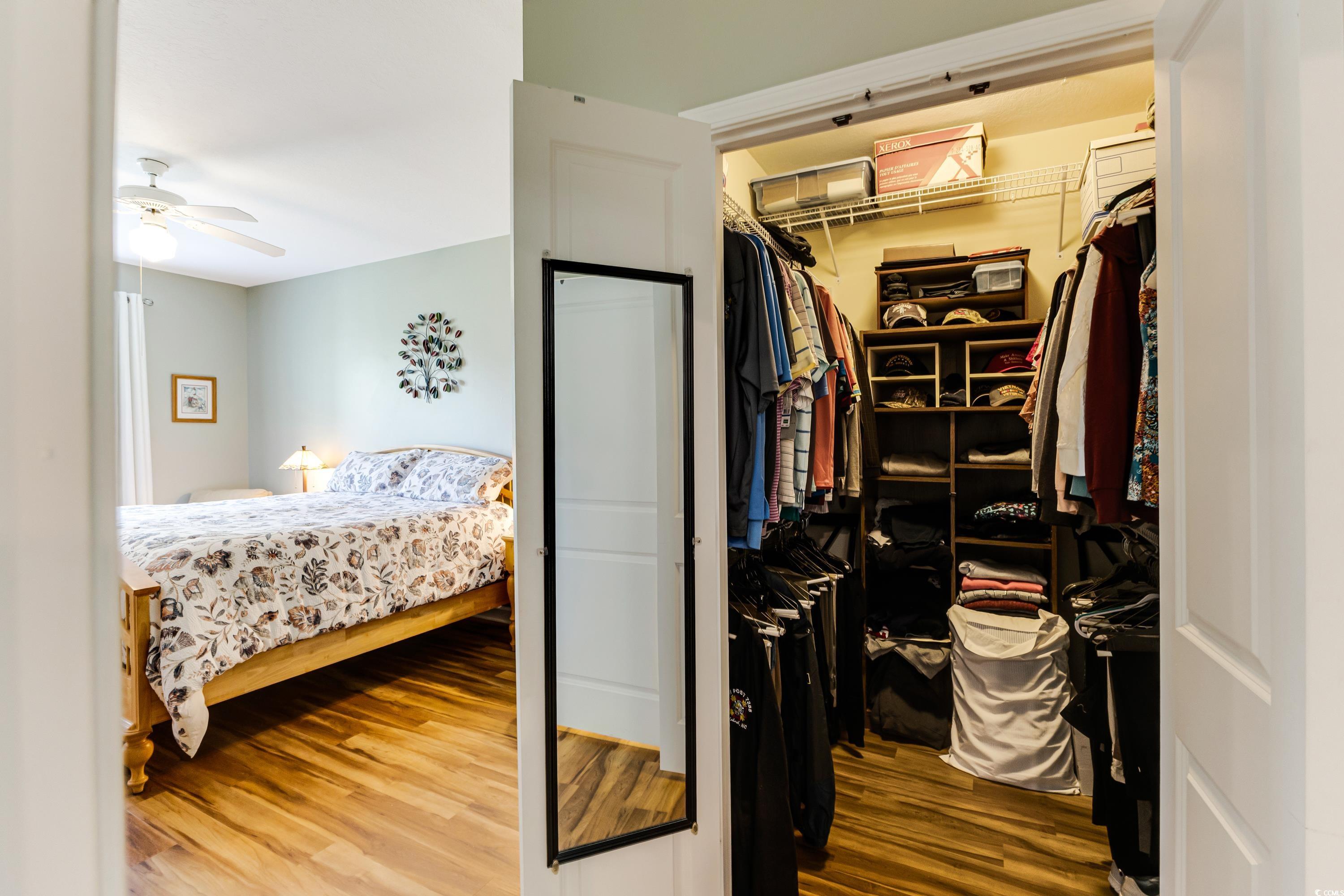 260 Woodlands Way, Unit 2 Calabash, NC 28467 - Photo 15 of 40 Bedroom with wood finished floors and a closet