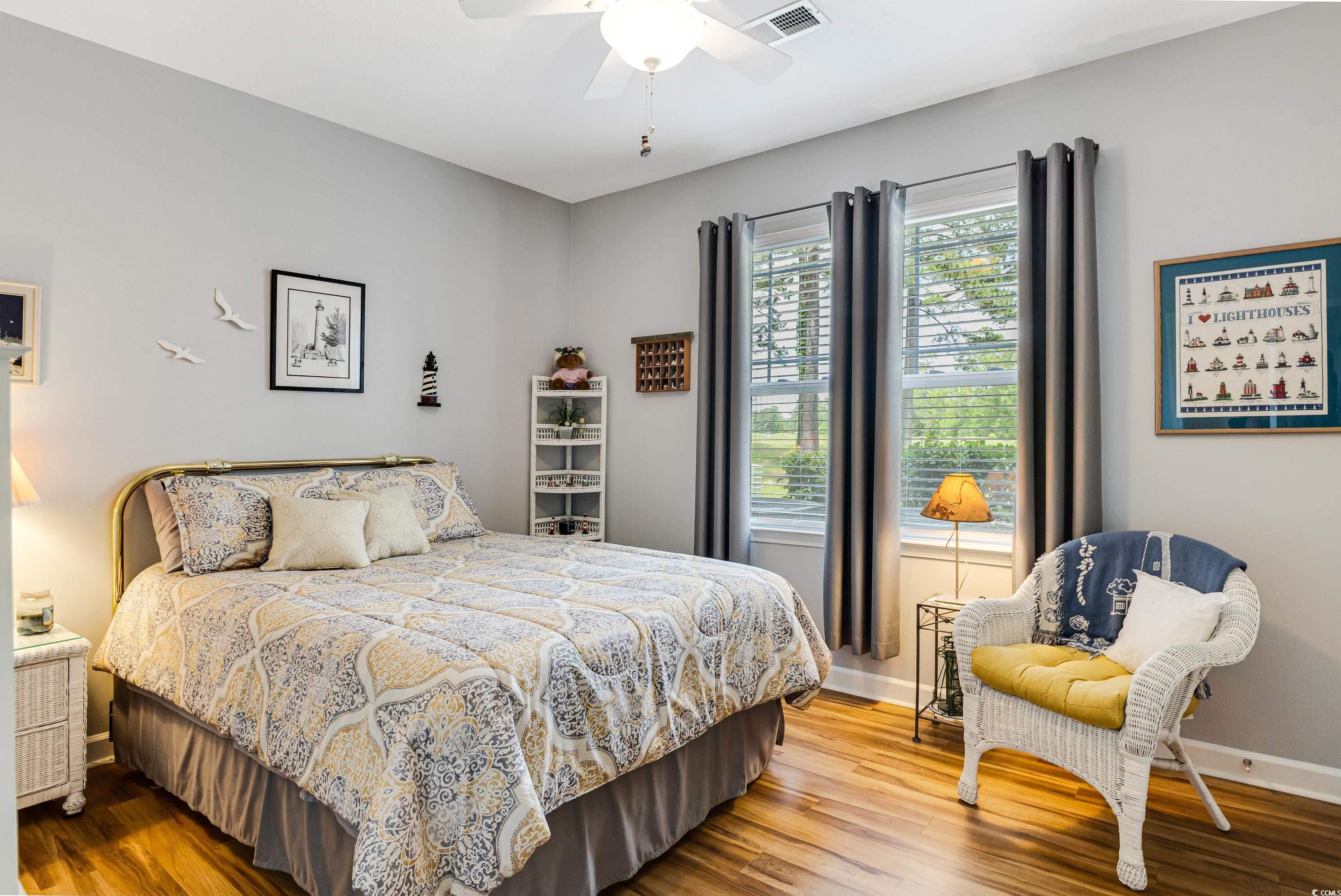 260 Woodlands Way, Unit 2 Calabash, NC 28467 - Photo 19 of 40 Bedroom with wood finished floors, baseboards, and ceiling fan