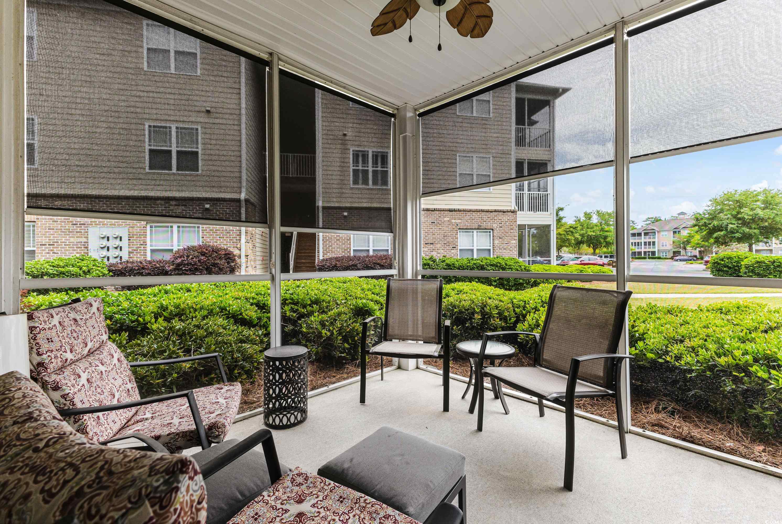260 Woodlands Way, Unit 2 Calabash, NC 28467 - Photo 26 of 40 Sunroom featuring a ceiling fan