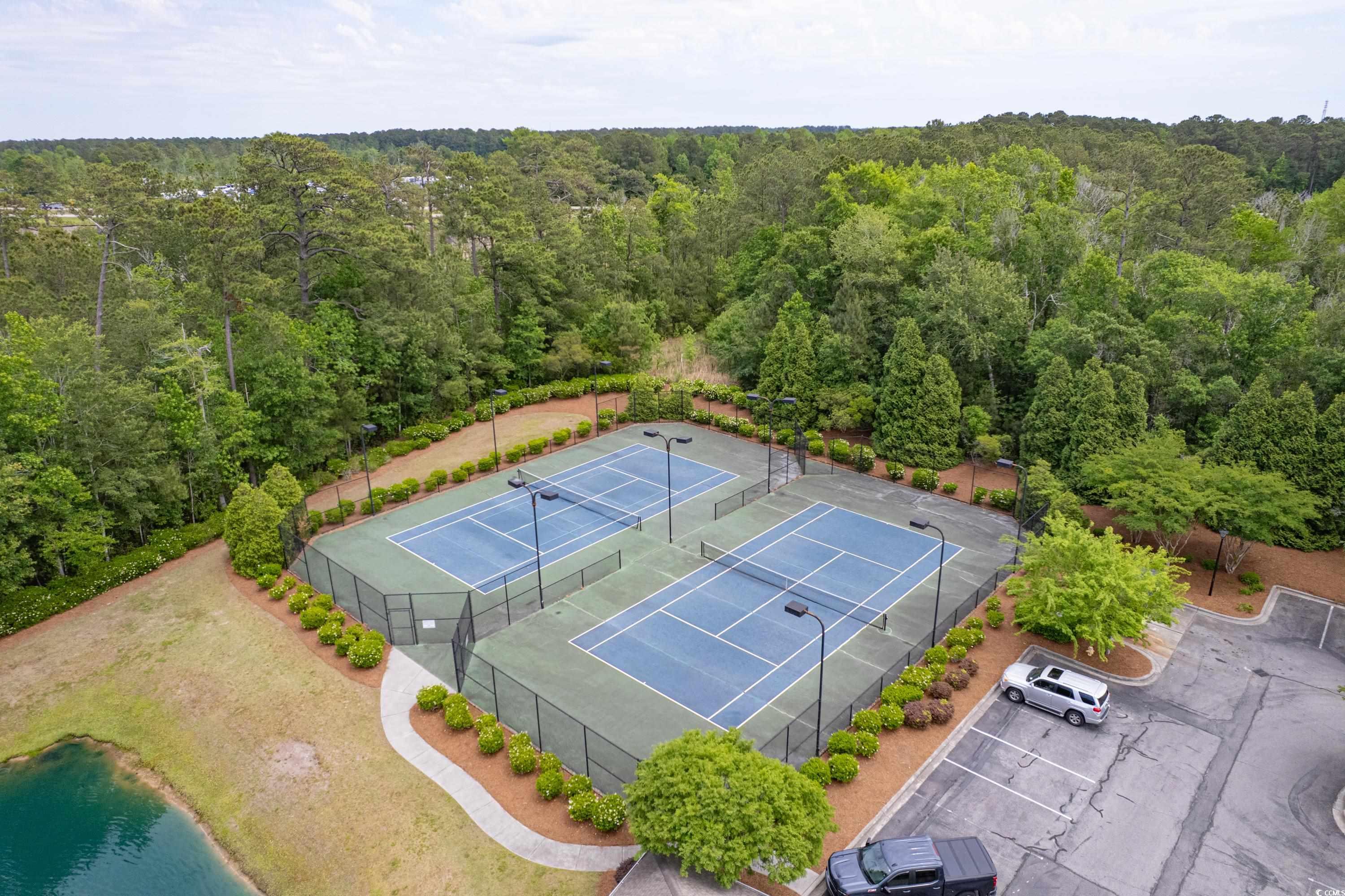 260 Woodlands Way, Unit 2 Calabash, NC 28467 - Photo 32 of 40 Drone / aerial view of a heavily wooded area and a large body of water