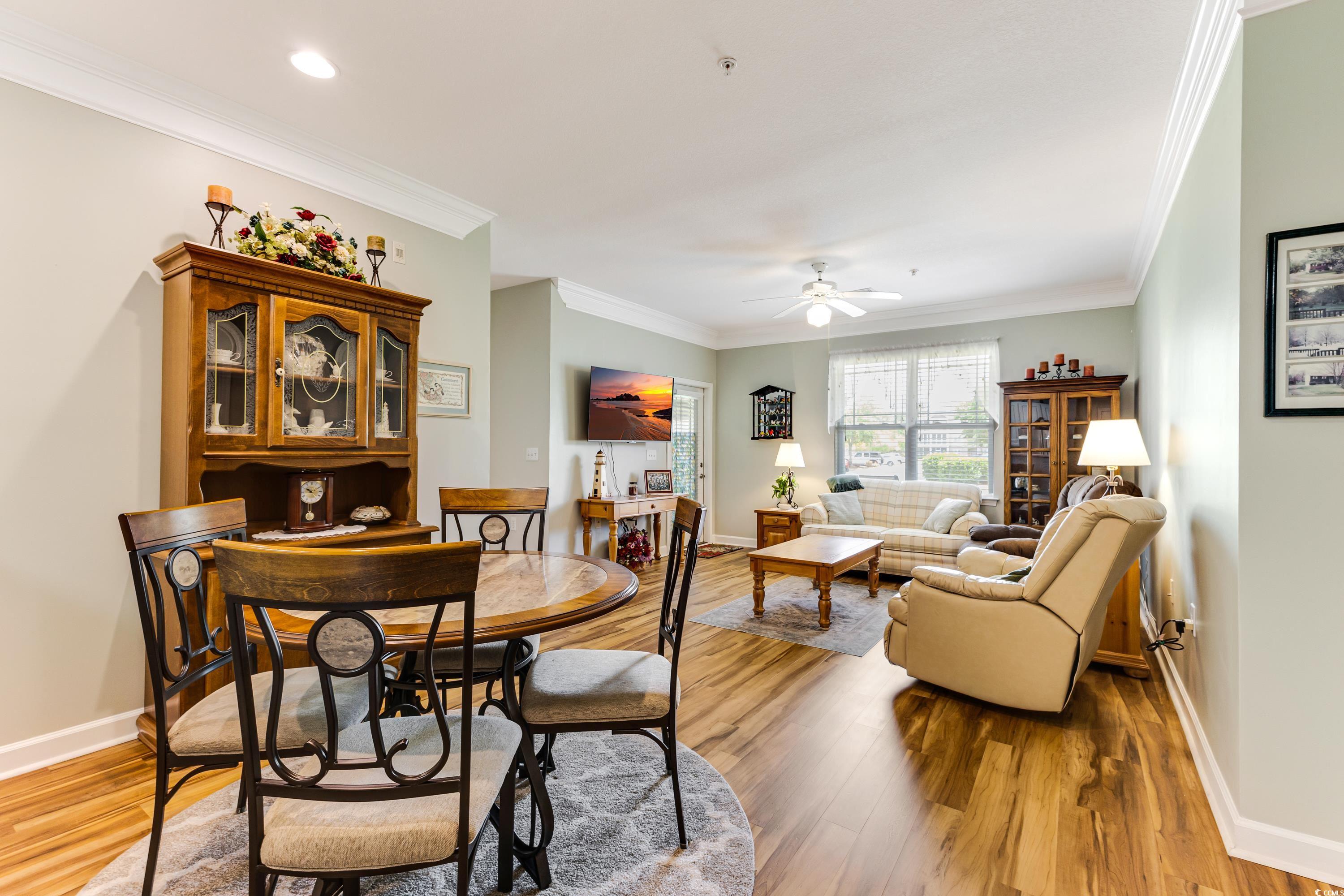 260 Woodlands Way, Unit 2 Calabash, NC 28467 - Photo 9 of 40 Dining space with ceiling fan, wood finished floors, baseboards, crown molding, and recessed lighting