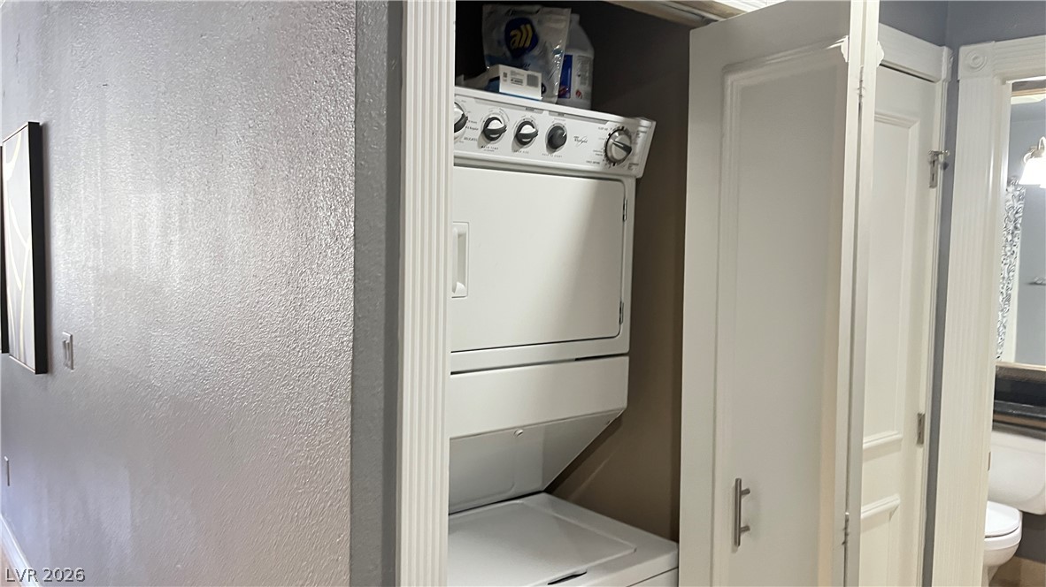 210 East Flamingo Road, Unit 205 Las Vegas, NV 89169 - Photo 17 of 17 A neatly integrated stacked washer and dryer unit provides essential convenience.