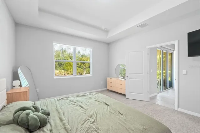 a bathroom with a shower and a glass door
