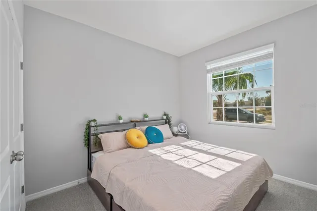 a view of a lake with houses in the background