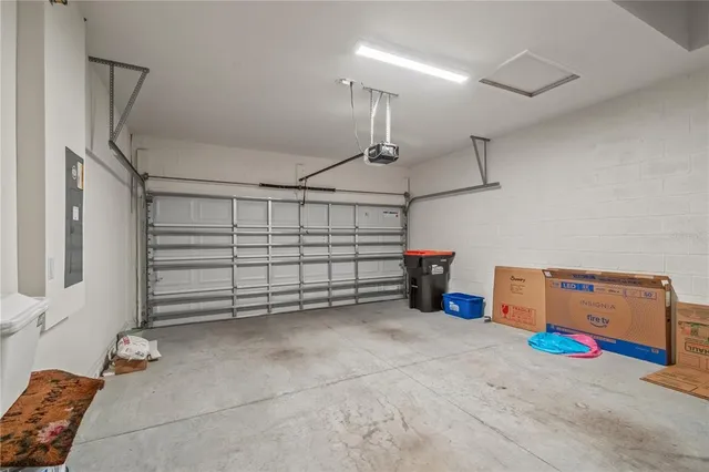 a view of swimming pool with outdoor seating and lake in the back