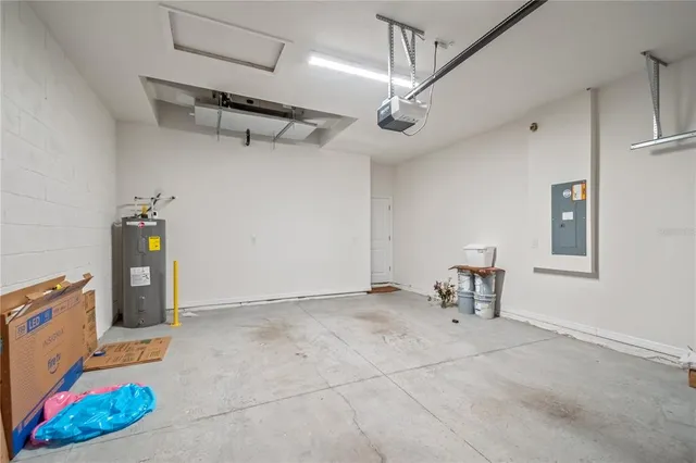 a view of a house with big yard and potted plants