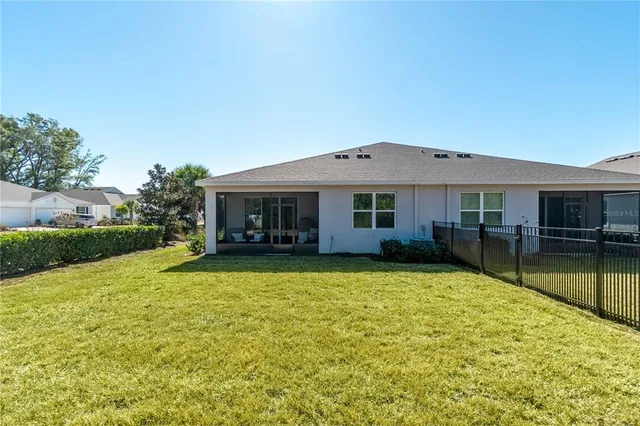 a living room with furniture a window and a flat screen tv