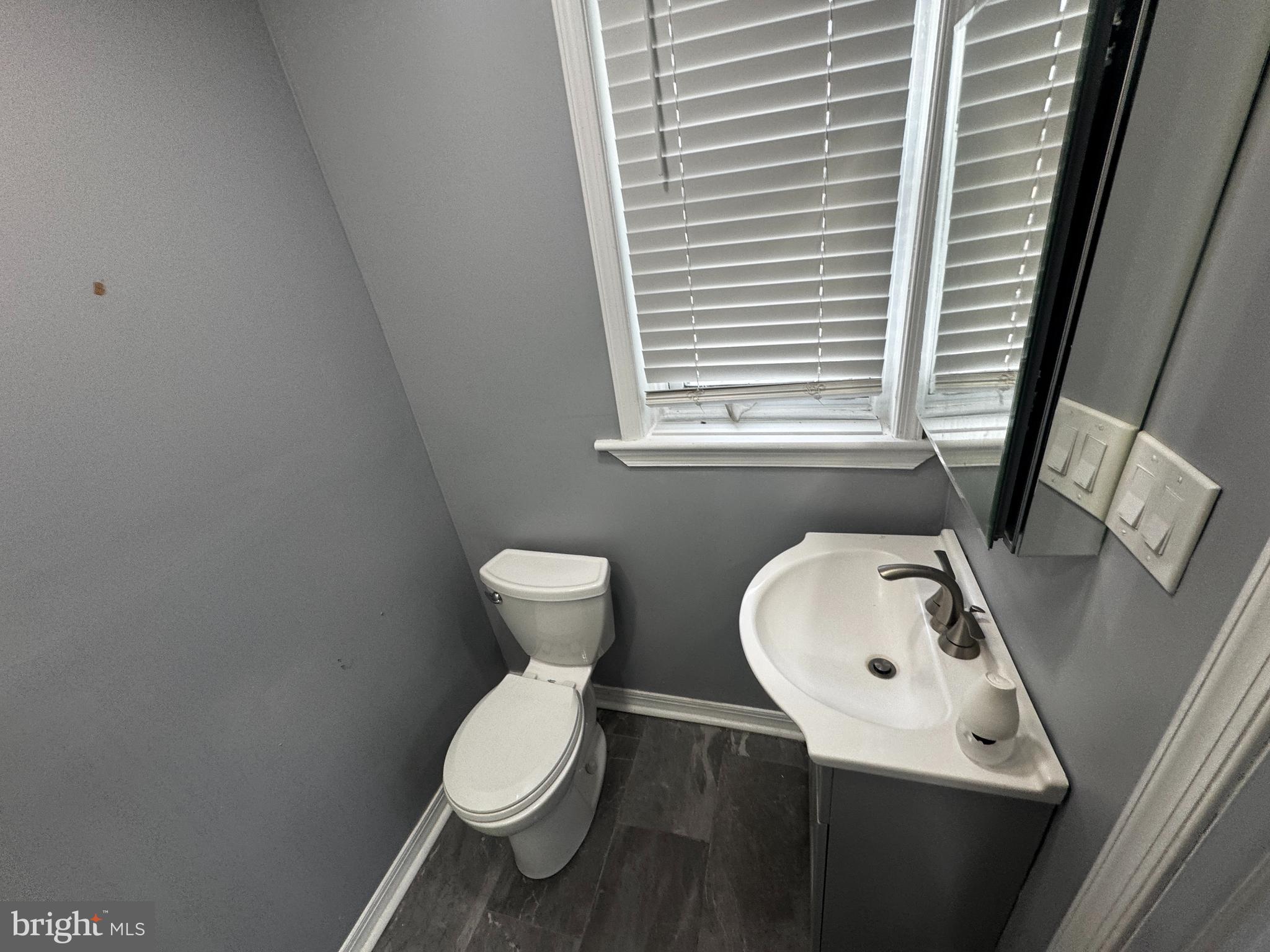 700 Lloyd Street Chester, PA 19013 - Photo 25 of 32 a white toilet sitting next to a white sink