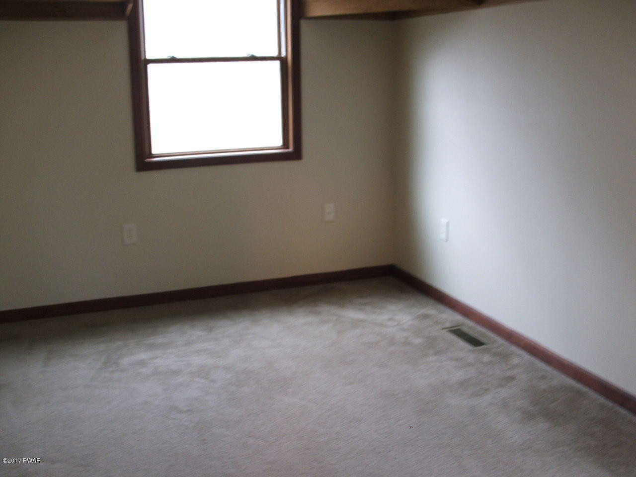 105 Butternut Road Milford, PA 18337 - Photo 3 of 8 an empty room with a window