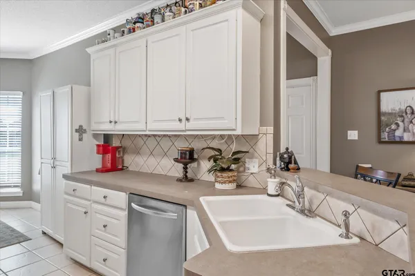 a kitchen with a sink and cabinets
