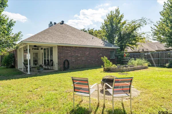 a view of an house with swimming pool and porch