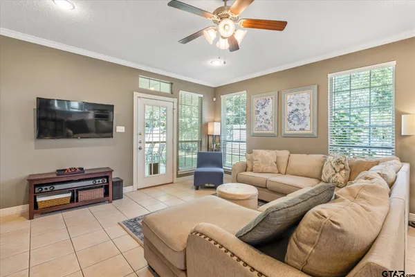 a living room with furniture a fireplace and a rug