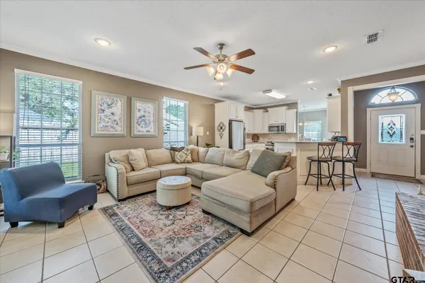 a kitchen with stainless steel appliances a refrigerator and a stove top oven