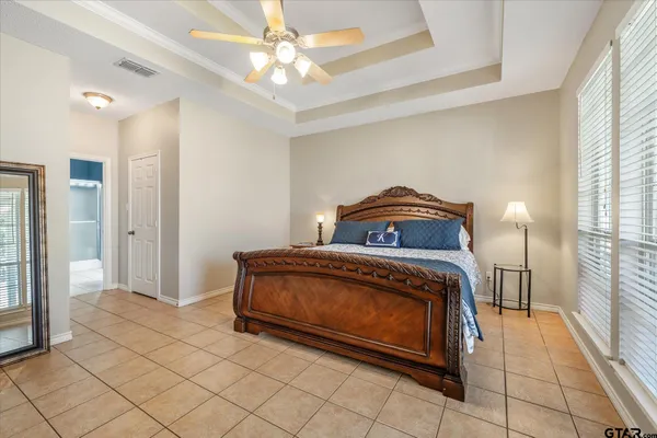 a bedroom with a bed and a view of bathroom