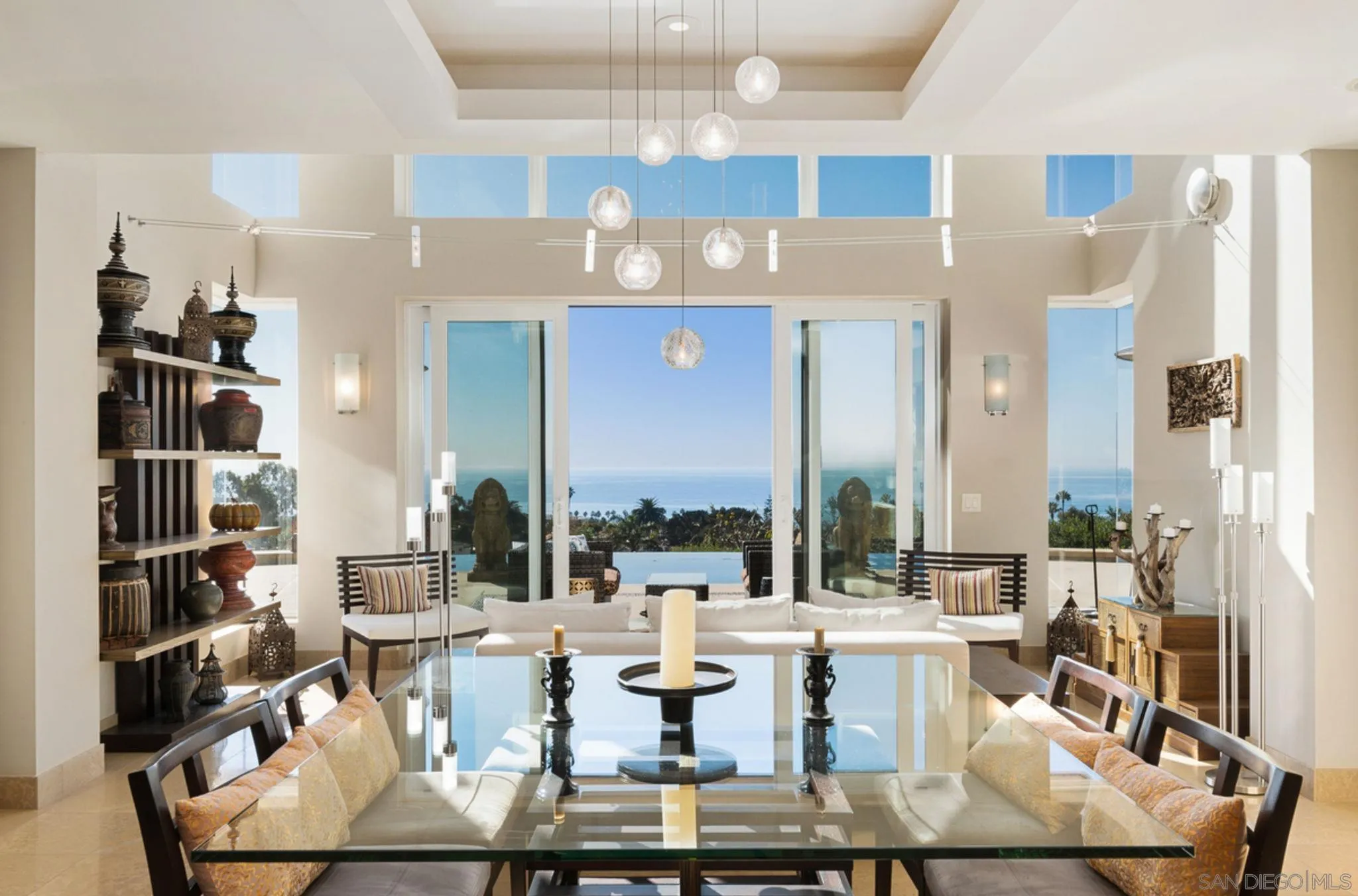 5680 Linda Rosa Avenue La Jolla, CA 92037 - Photo 22 of 24 a living room with fireplace furniture and a large window