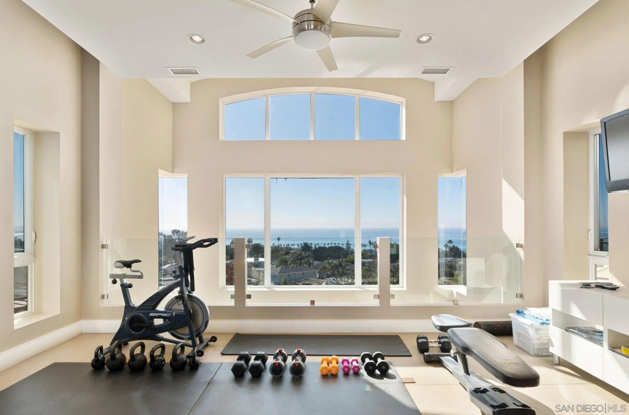 5680 Linda Rosa Avenue La Jolla, CA 92037 - Photo 10 of 24 a living room with furniture and large windows