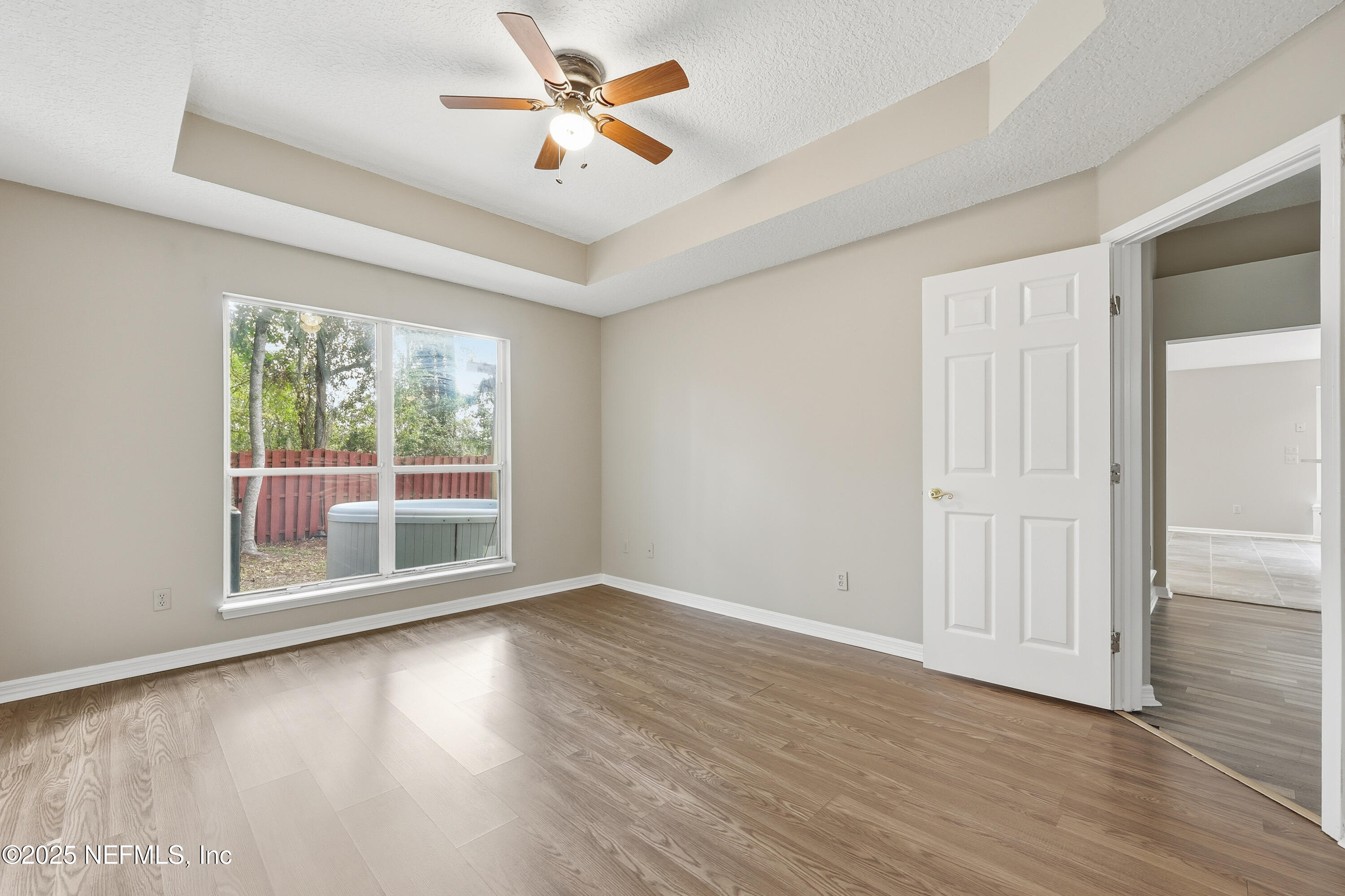 1655 Highland View Court Fleming Island, FL 32003 - Photo 23 of 56 wooden floor in an empty room with a window