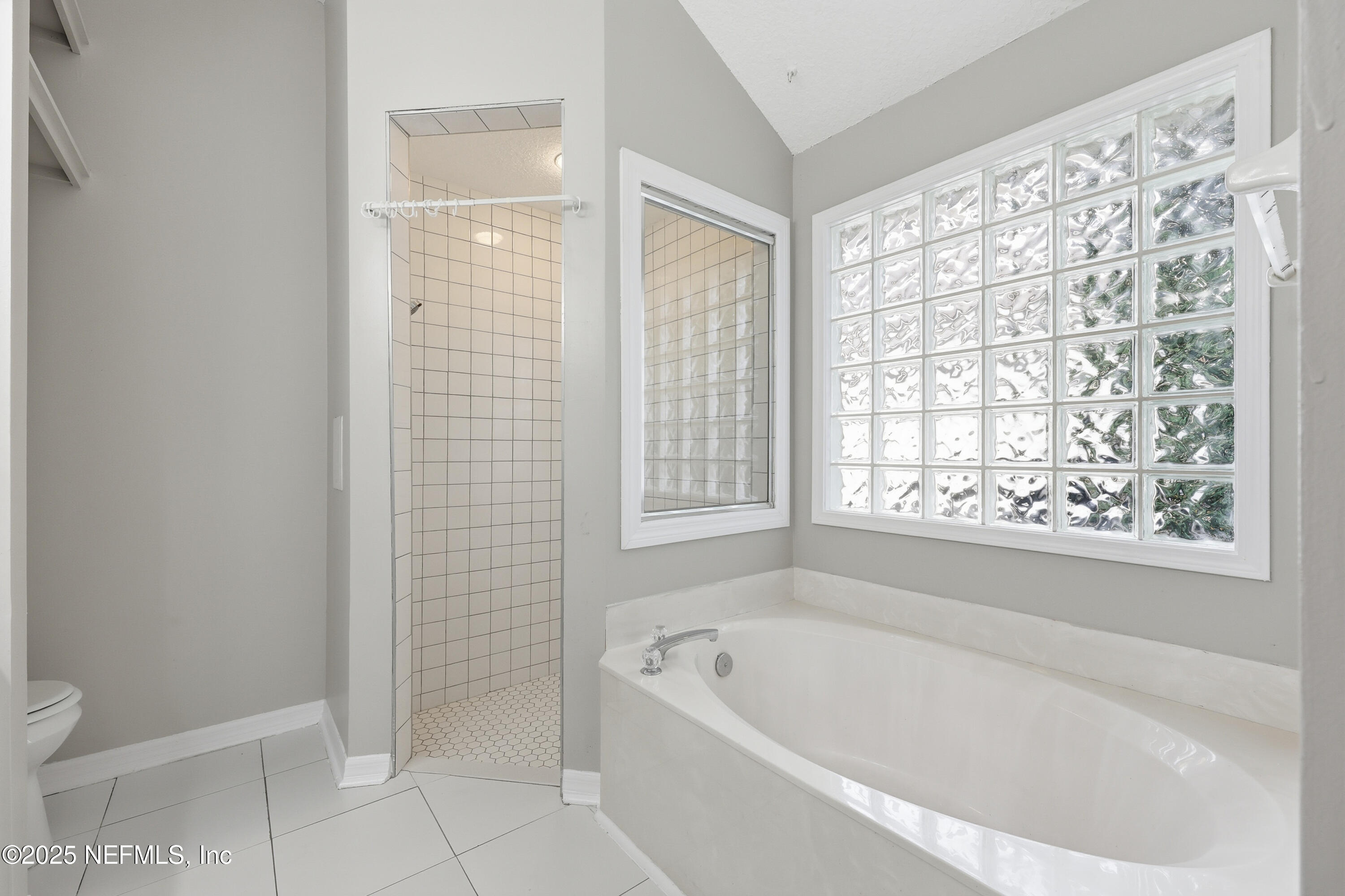 1655 Highland View Court Fleming Island, FL 32003 - Photo 25 of 56 a white bath tub sitting next to a white sink