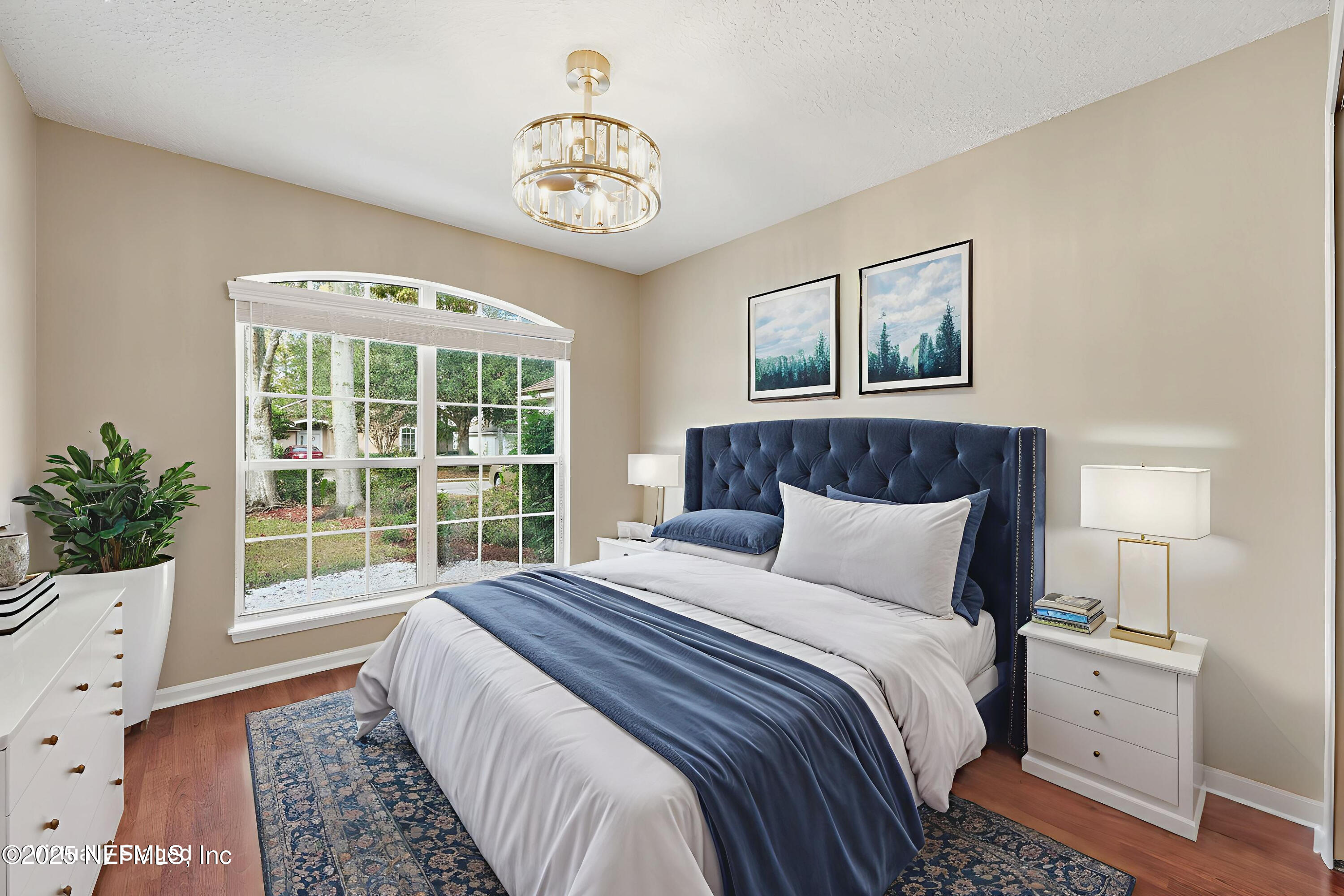 1655 Highland View Court Fleming Island, FL 32003 - Photo 26 of 56 a bedroom with a large bed and a window