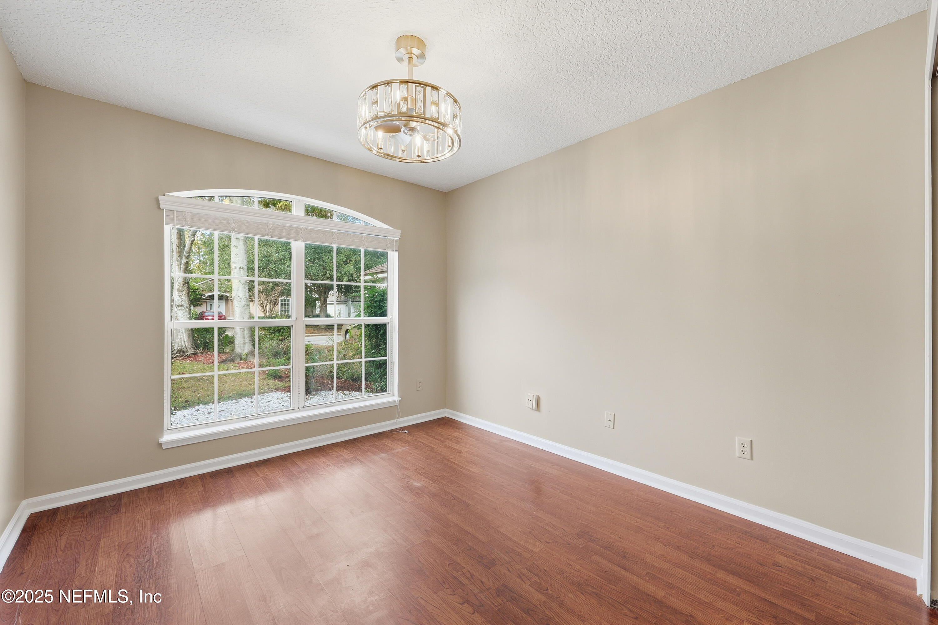 1655 Highland View Court Fleming Island, FL 32003 - Photo 27 of 56 an empty room with wooden floor and a window