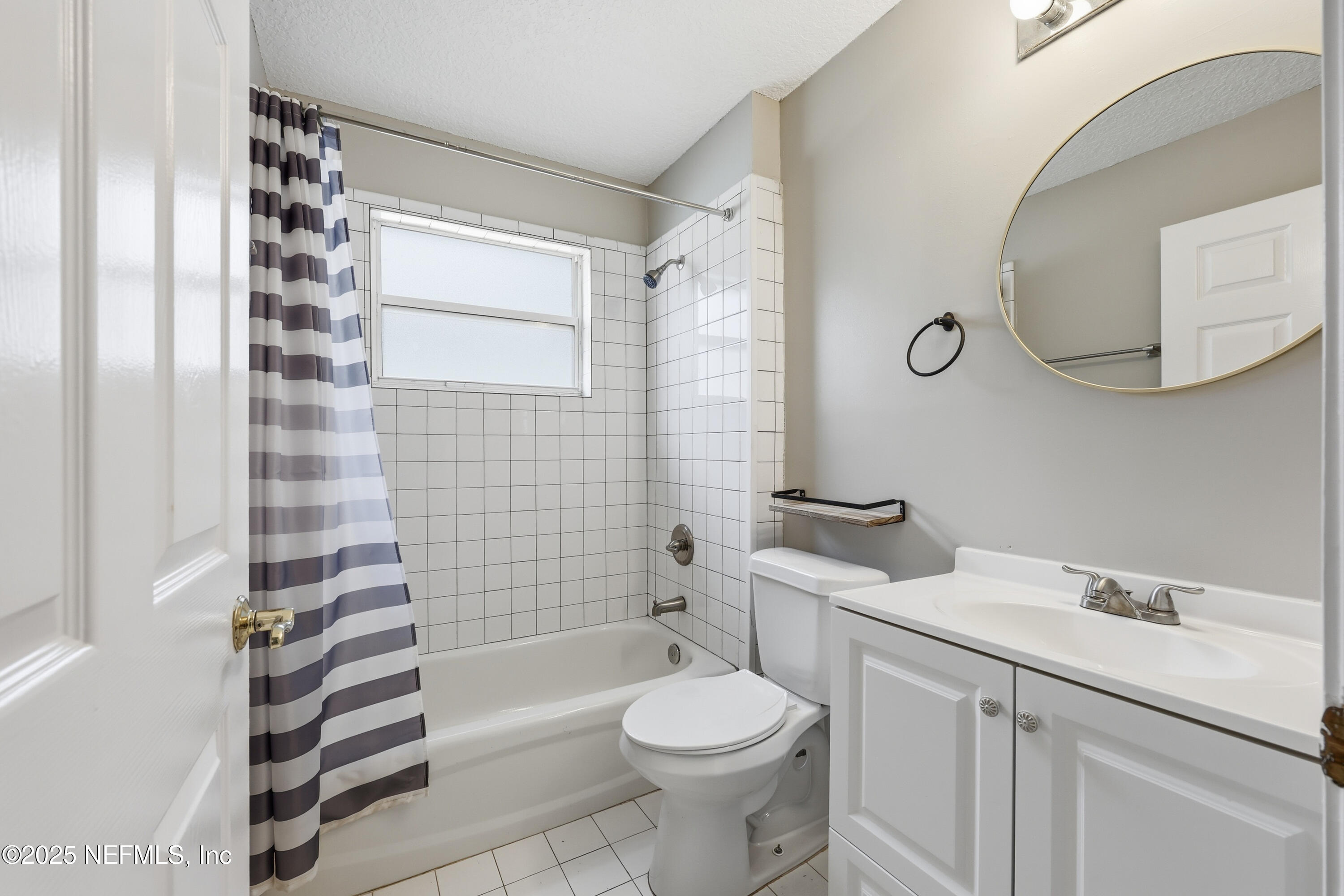 1655 Highland View Court Fleming Island, FL 32003 - Photo 28 of 56 a bathroom with a sink toilet and shower