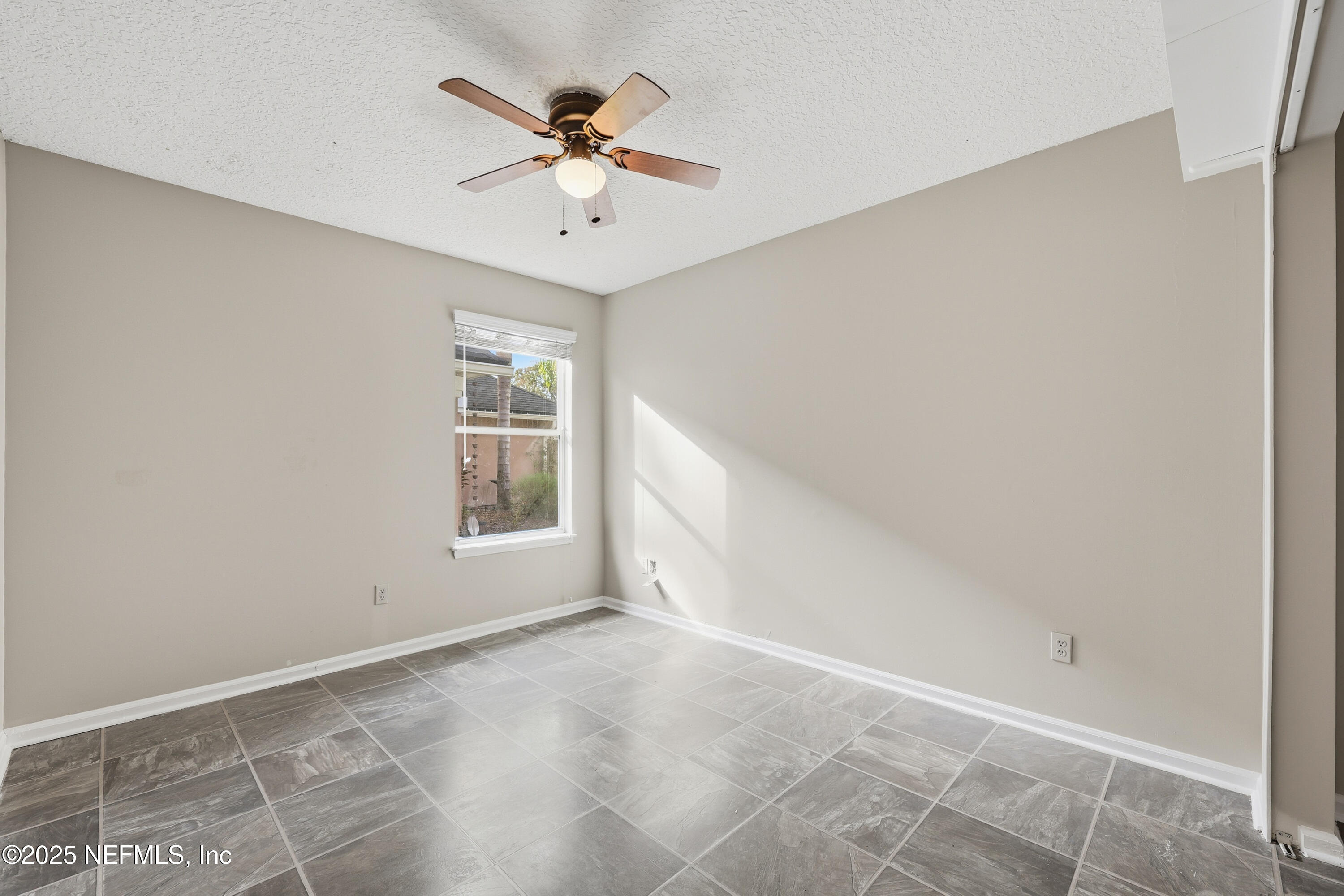 1655 Highland View Court Fleming Island, FL 32003 - Photo 31 of 56 a view of an empty room with a window
