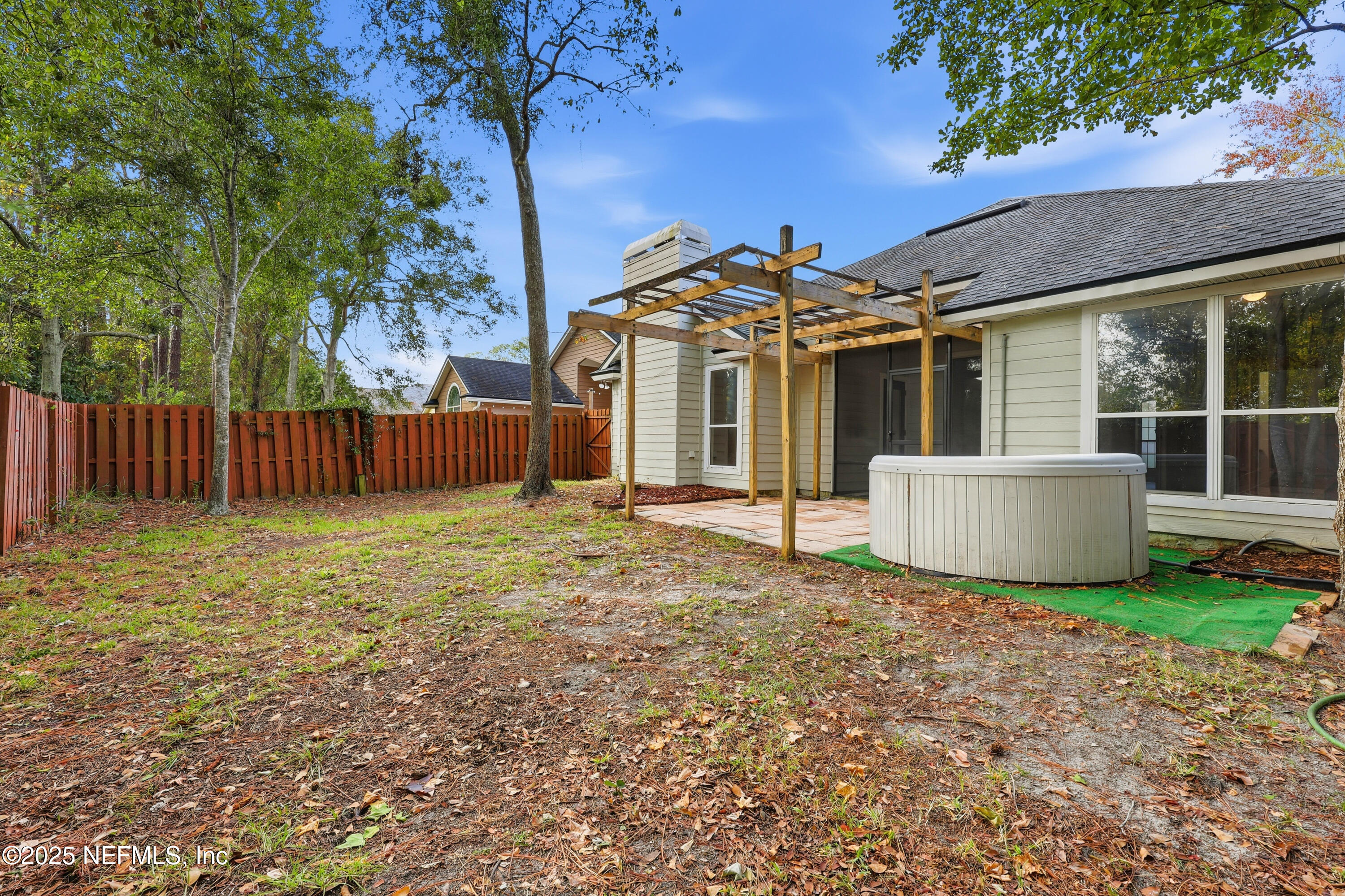 1655 Highland View Court Fleming Island, FL 32003 - Photo 35 of 56 a view of a house with backyard and a tree
