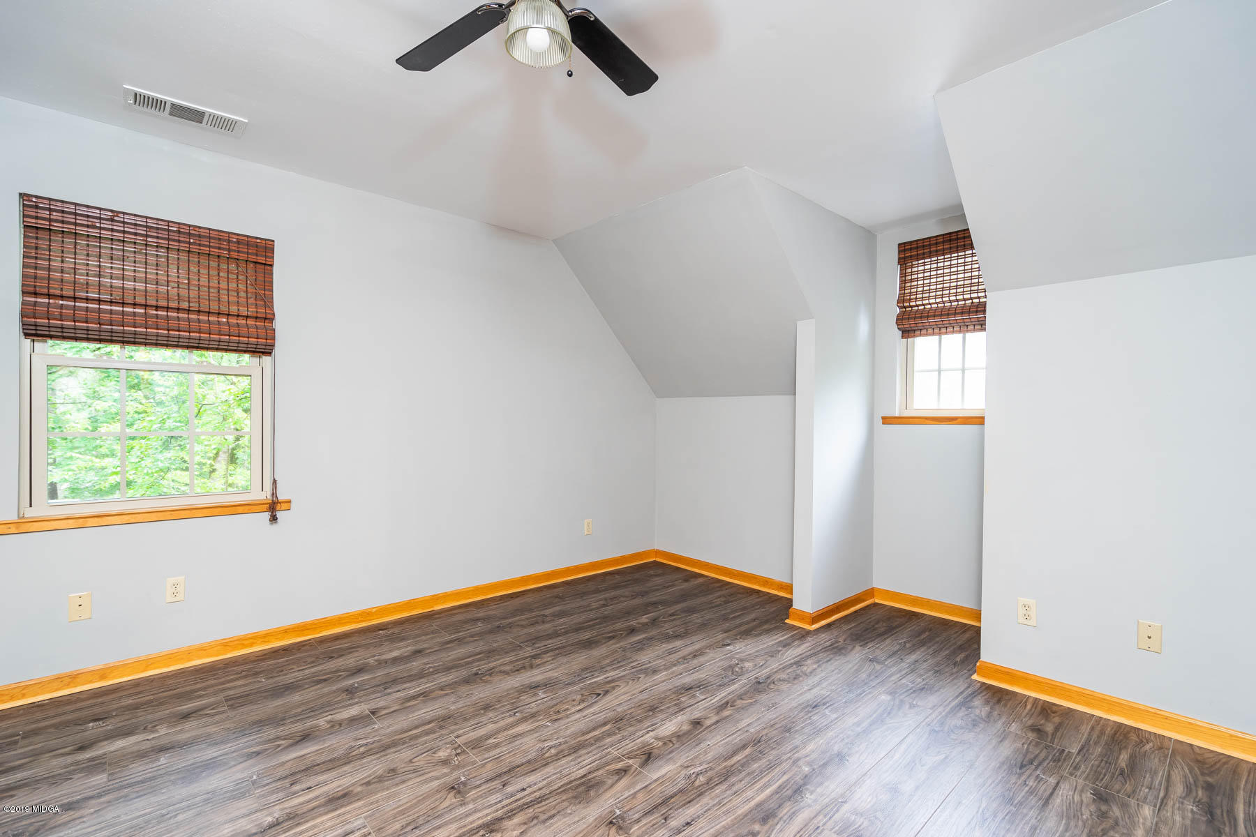 5934 Dames Ferry Road Juliette, GA 31046 - Photo 20 of 41 an empty room with wooden floor cabinet and windows