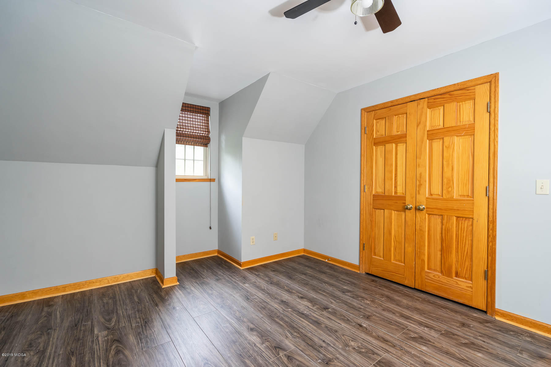 5934 Dames Ferry Road Juliette, GA 31046 - Photo 21 of 41 an empty room with wooden floor and closet