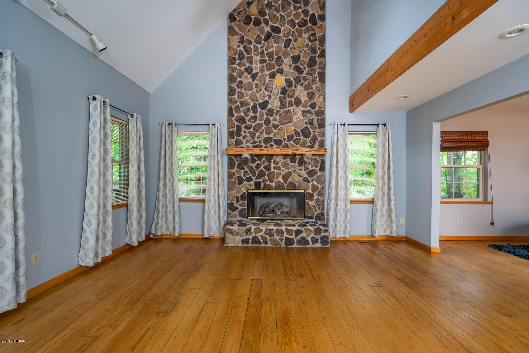 5934 Dames Ferry Road Juliette, GA 31046 - Photo 4 of 41 a view of a livingroom with wooden floor and a fireplace