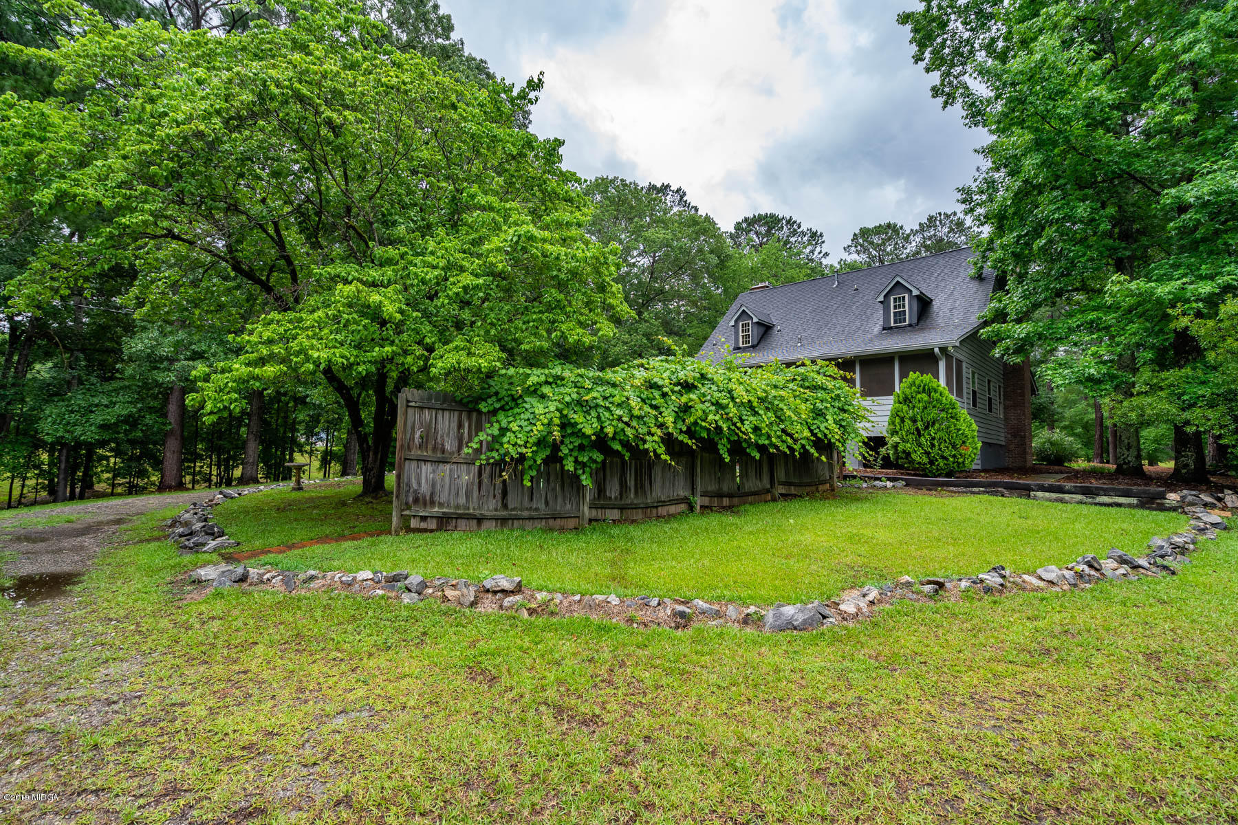 5934 Dames Ferry Road Juliette, GA 31046 - Photo 35 of 41 a front view of a house with a yard and trees