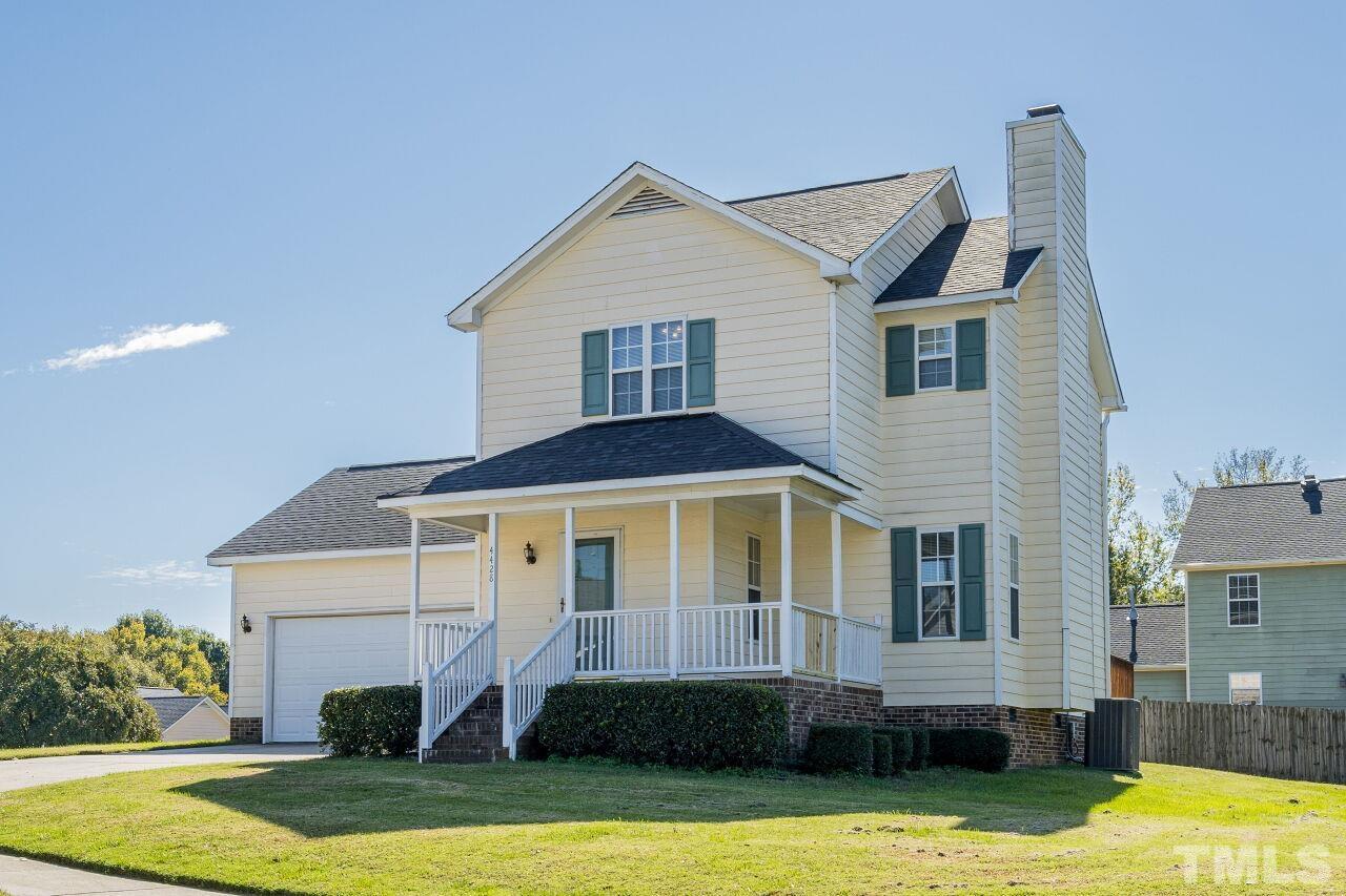 4428 Moss Spring Drive Raleigh, NC 27616 - Photo 1 of 27 a front view of a house with a yard
