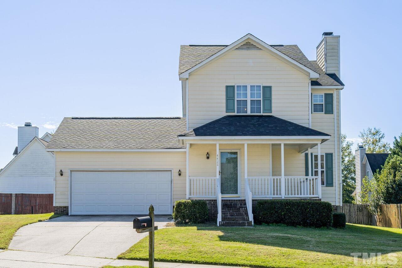 4428 Moss Spring Drive Raleigh, NC 27616 - Photo 2 of 27 a front view of a house with a yard