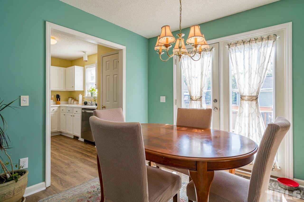 4428 Moss Spring Drive Raleigh, NC 27616 - Photo 11 of 27 a view of a dining room with furniture window and outside view