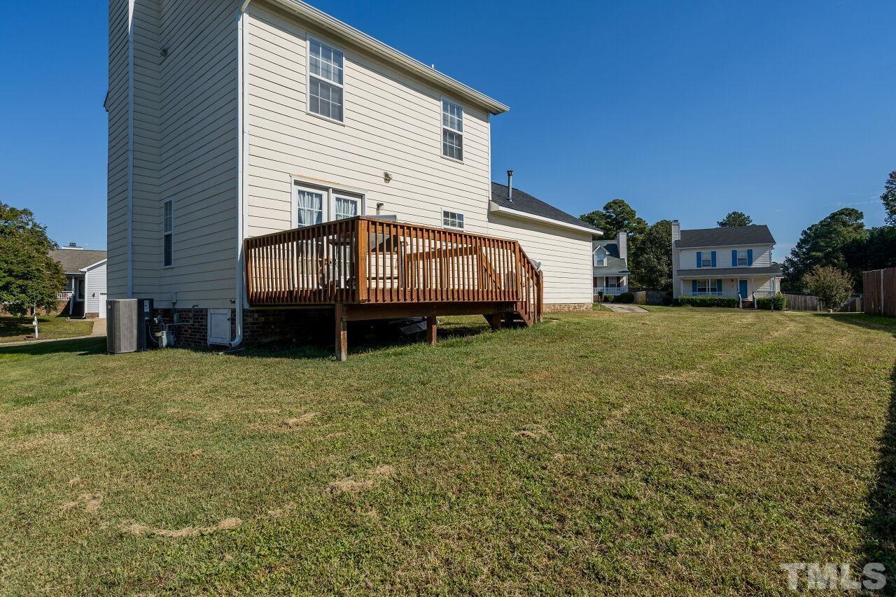 4428 Moss Spring Drive Raleigh, NC 27616 - Photo 24 of 27 a view of a house with a yard and sitting area