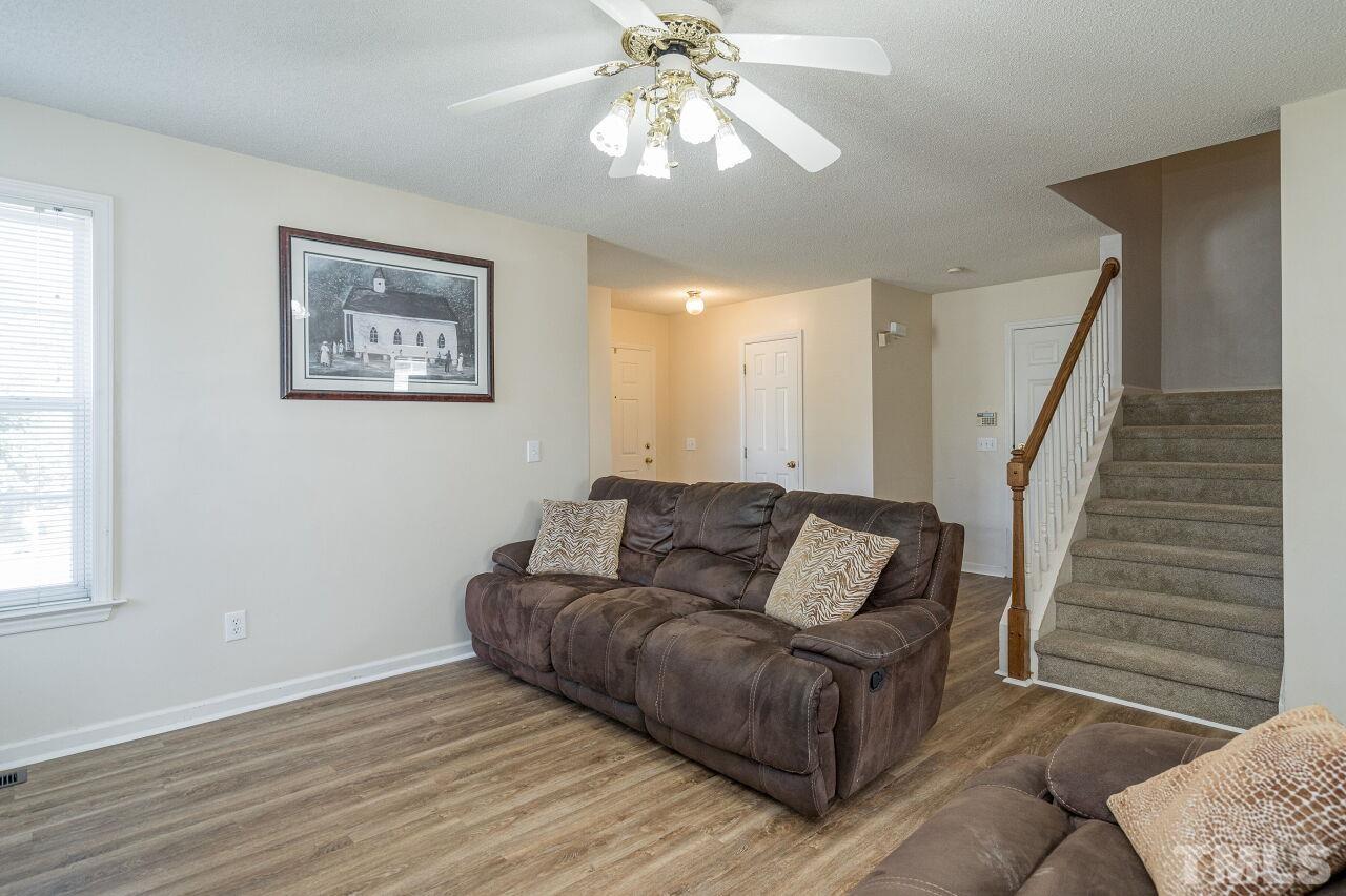 4428 Moss Spring Drive Raleigh, NC 27616 - Photo 6 of 27 a living room with furniture and a window