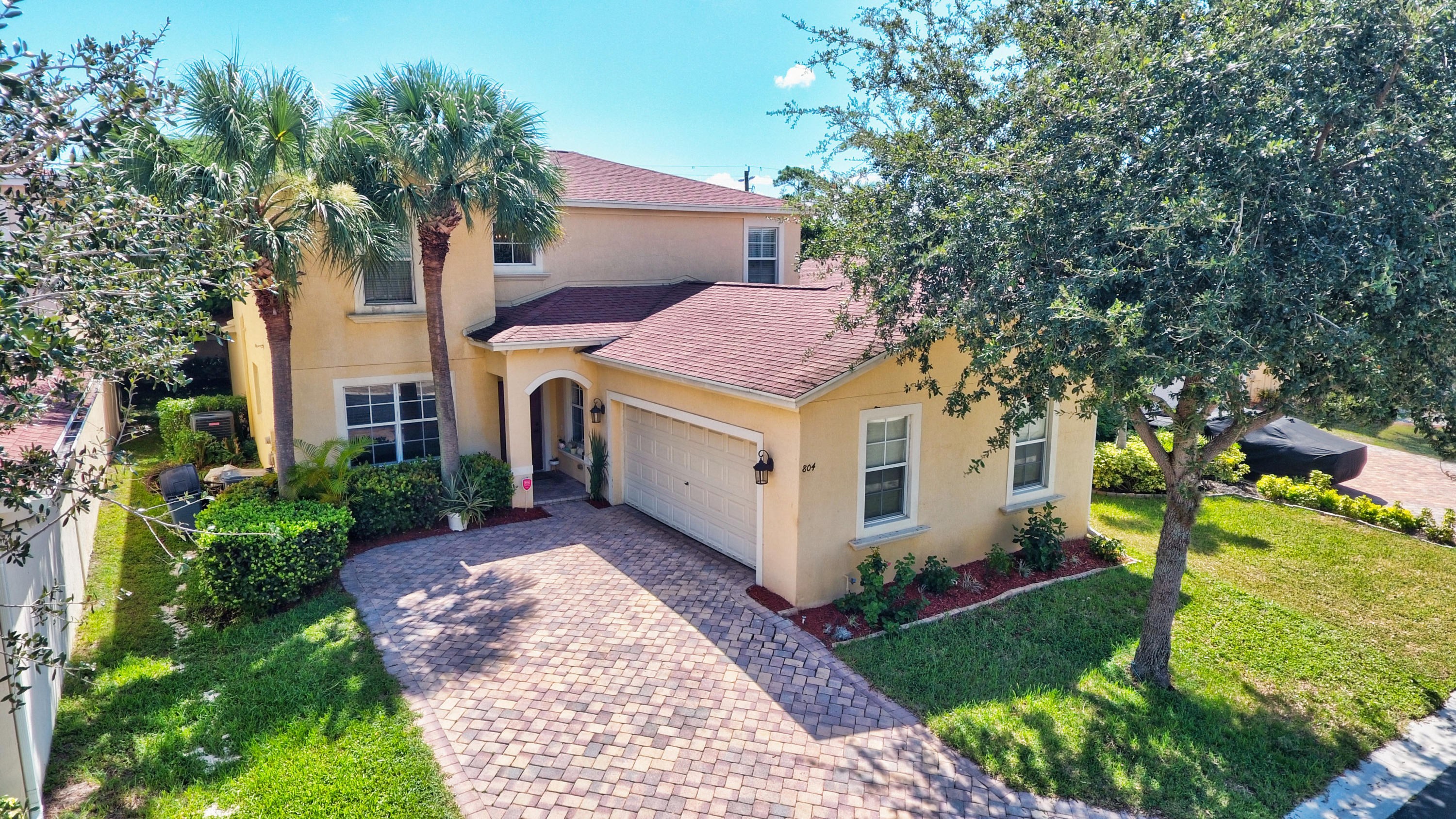 804 Quartz Terrace West Palm Beach, FL 33413 - Photo 1 of 65 a front view of a house with garden
