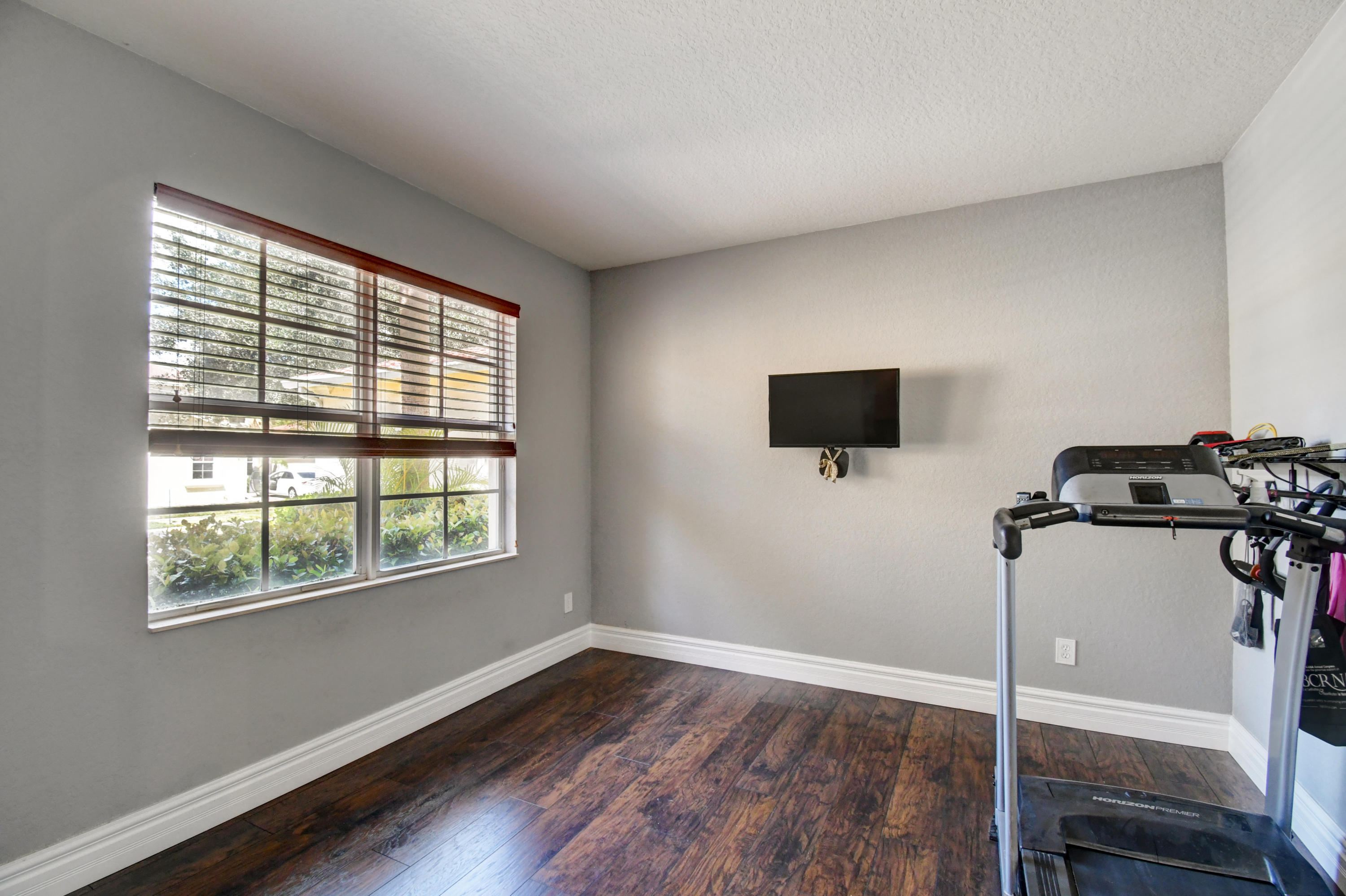 804 Quartz Terrace West Palm Beach, FL 33413 - Photo 11 of 65 a view of a room with a flat screen tv and a window