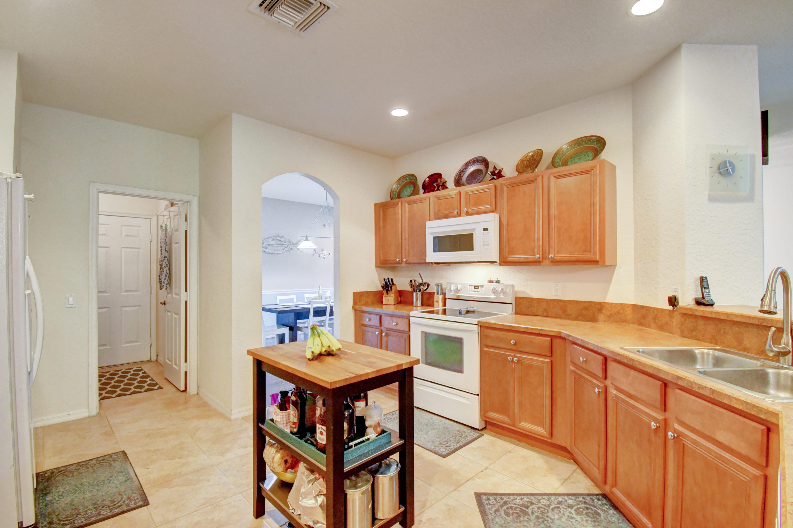804 Quartz Terrace West Palm Beach, FL 33413 - Photo 18 of 65 a kitchen with a sink cabinets and wooden floor