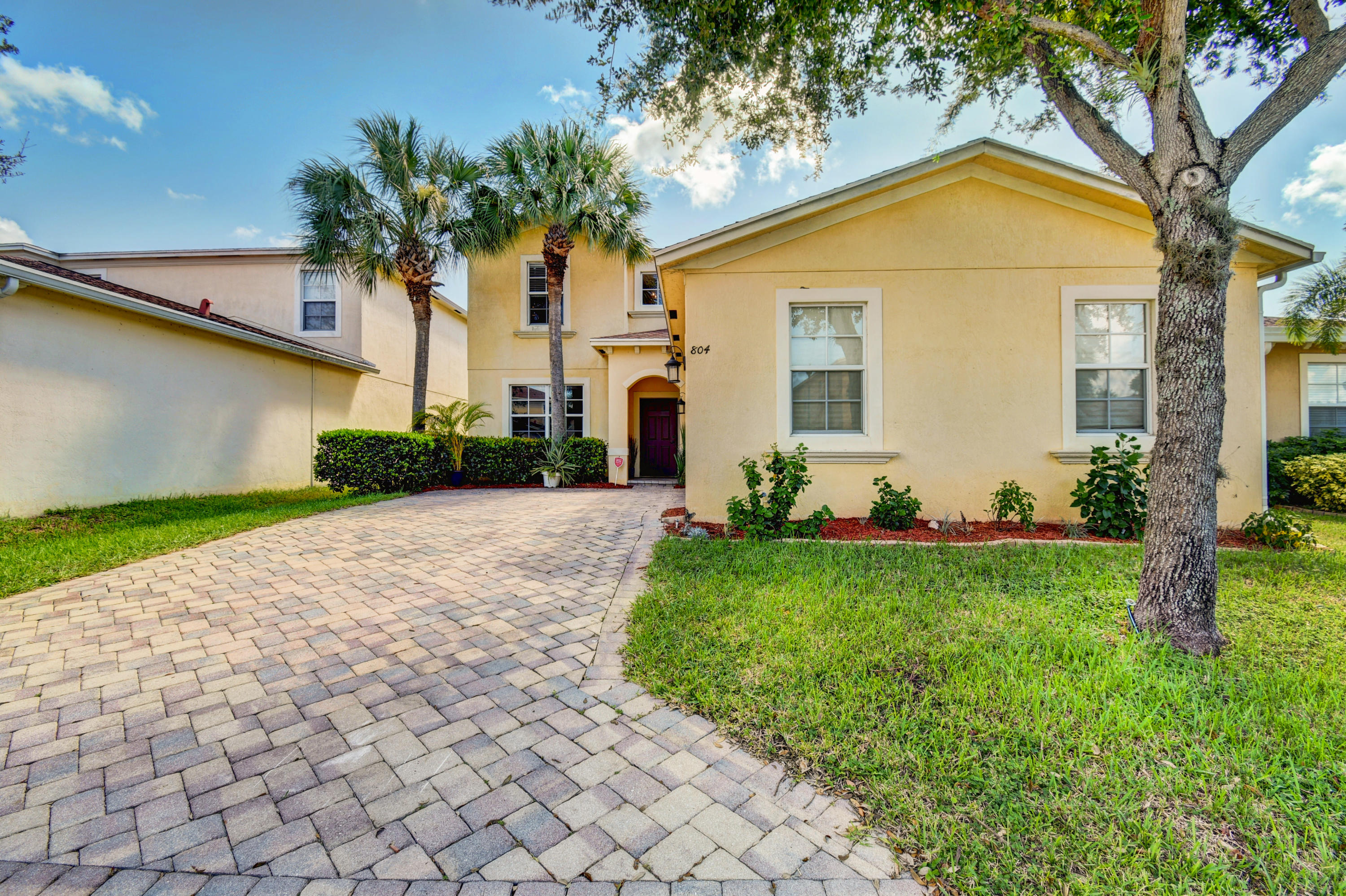 804 Quartz Terrace West Palm Beach, FL 33413 - Photo 2 of 65 a front view of a house with garden