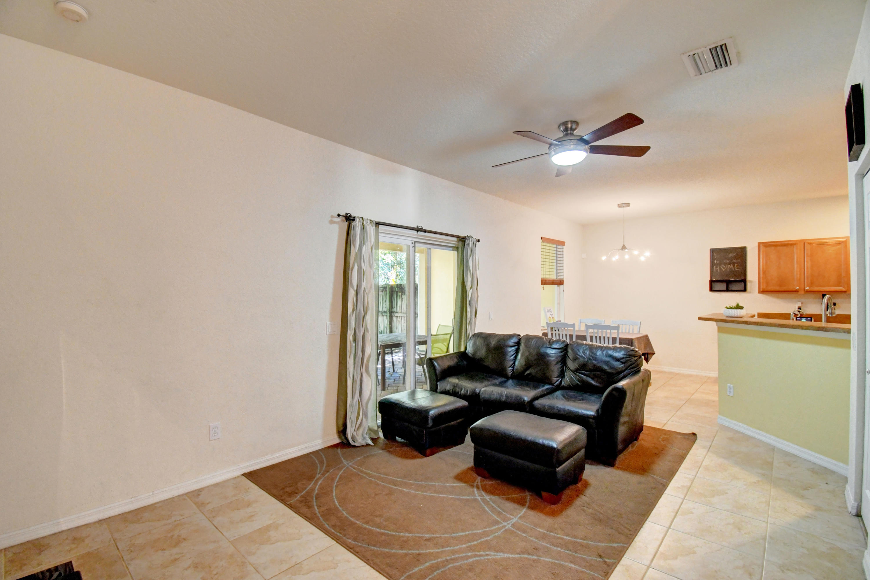 804 Quartz Terrace West Palm Beach, FL 33413 - Photo 22 of 65 a living room with furniture and a wooden floor