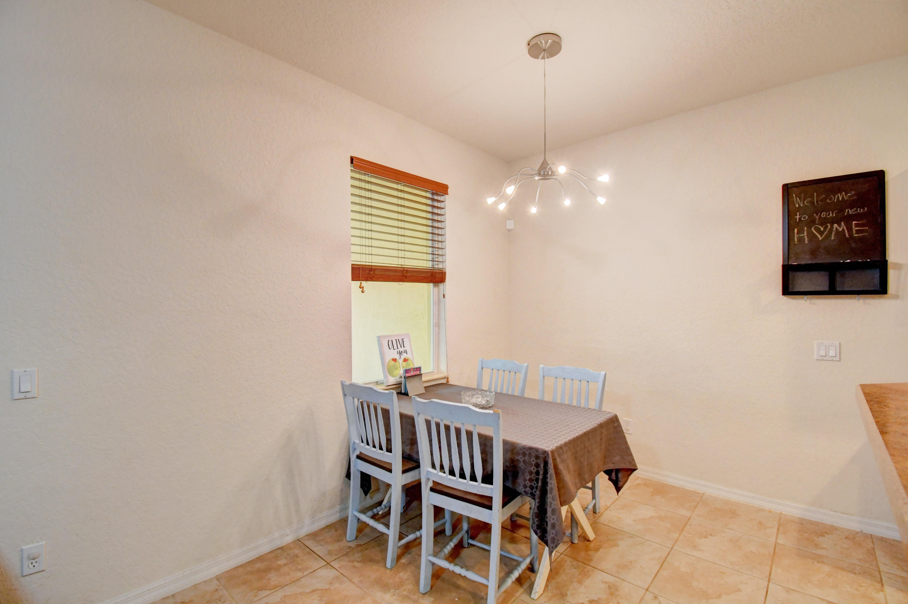 804 Quartz Terrace West Palm Beach, FL 33413 - Photo 23 of 65 a dining room with furniture and window
