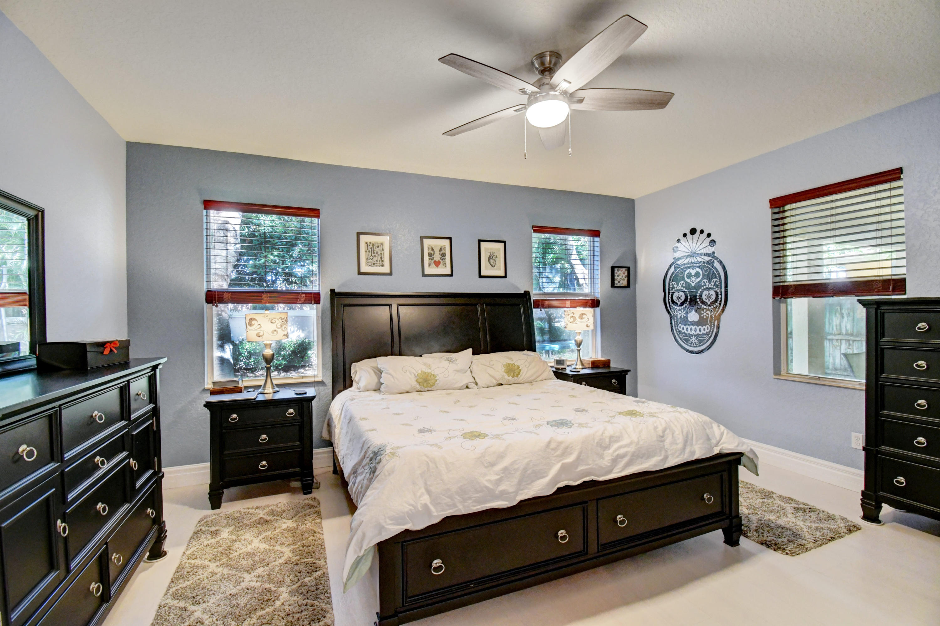 804 Quartz Terrace West Palm Beach, FL 33413 - Photo 26 of 65 a bedroom with a bed and a chandelier